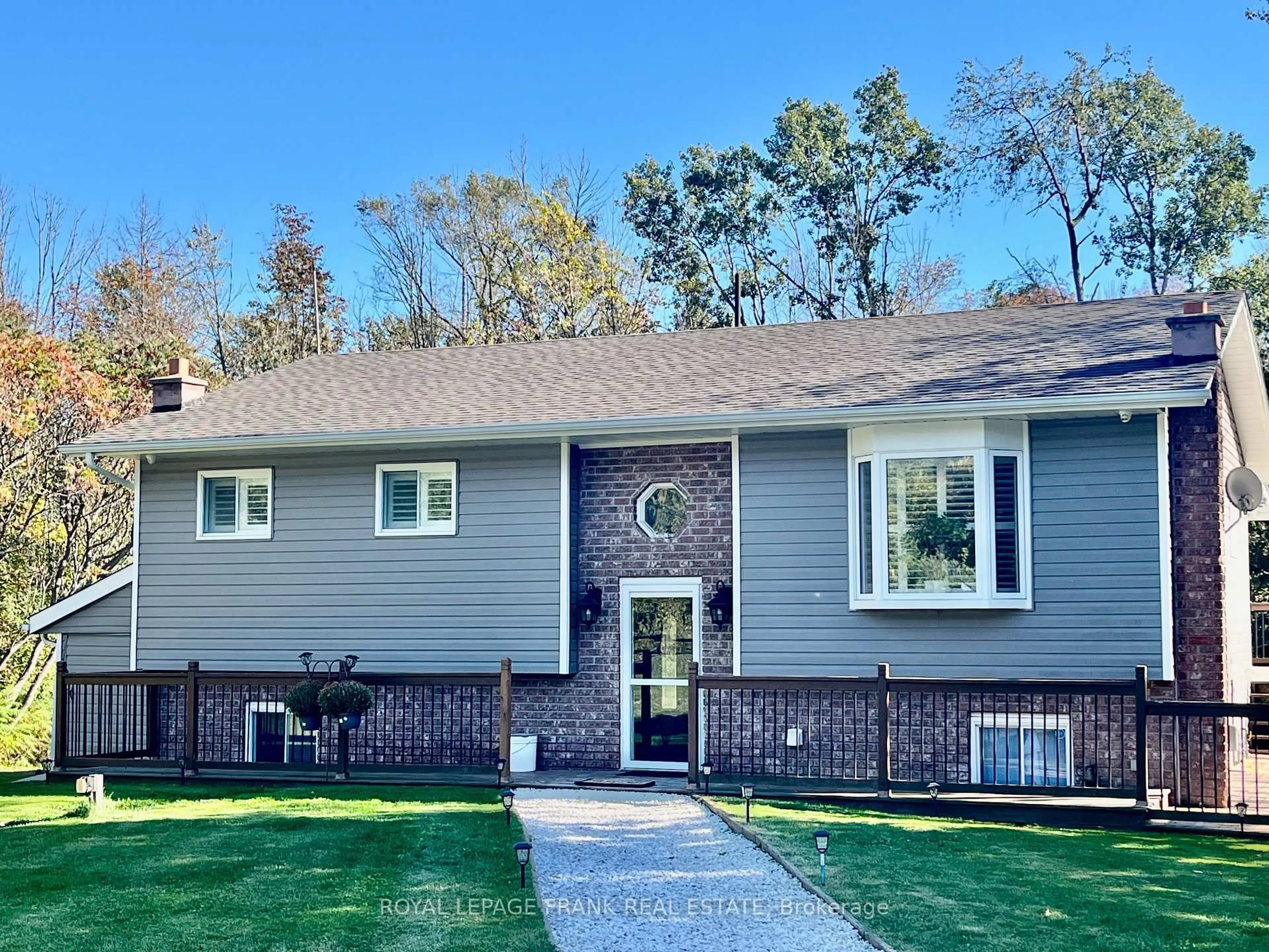 Home with vinyl exterior material, street for 15359 Little Lake Rd, Brighton Ontario K0K 1H0