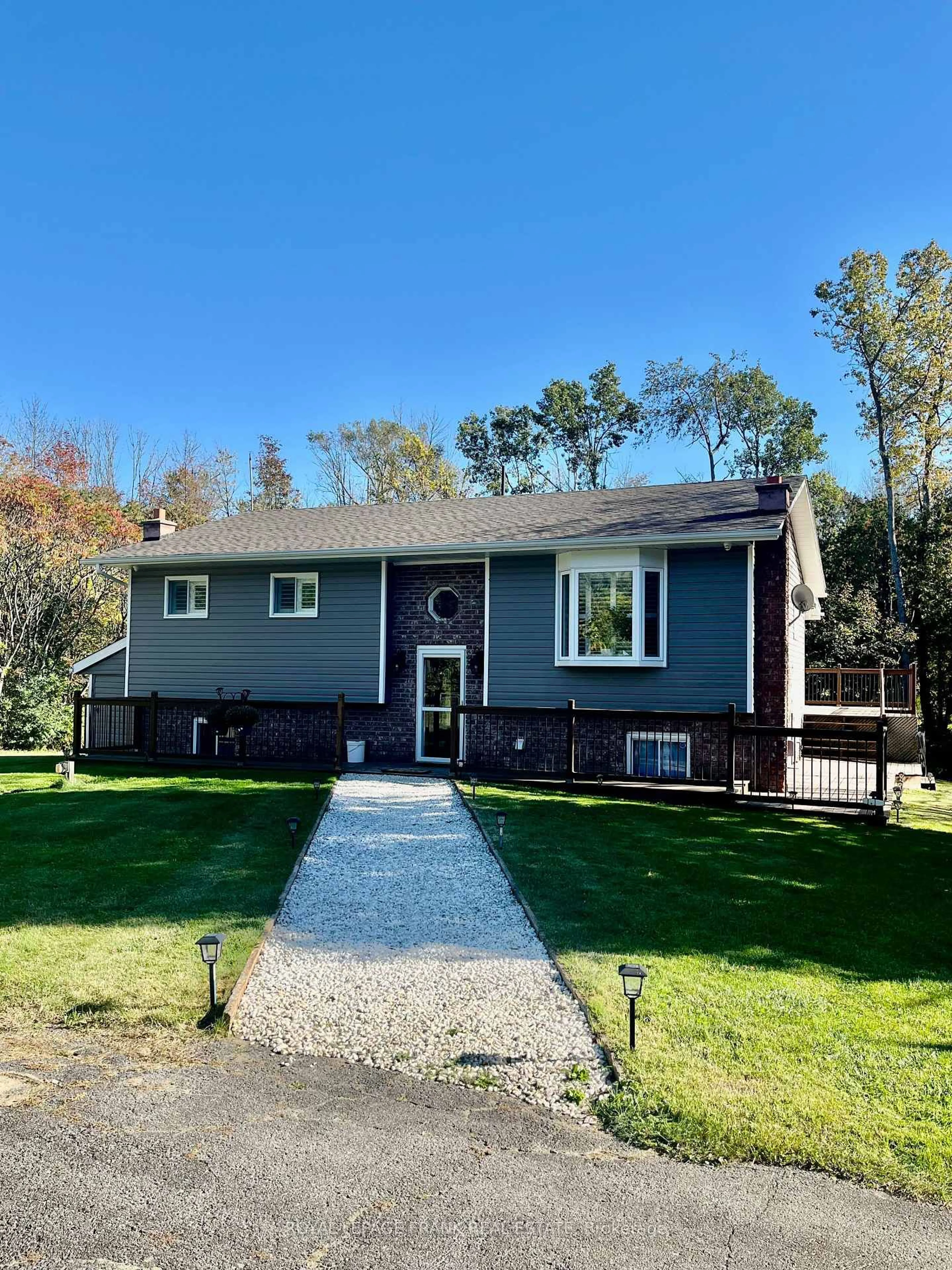 Home with vinyl exterior material, street for 15359 Little Lake Rd, Brighton Ontario K0K 1H0