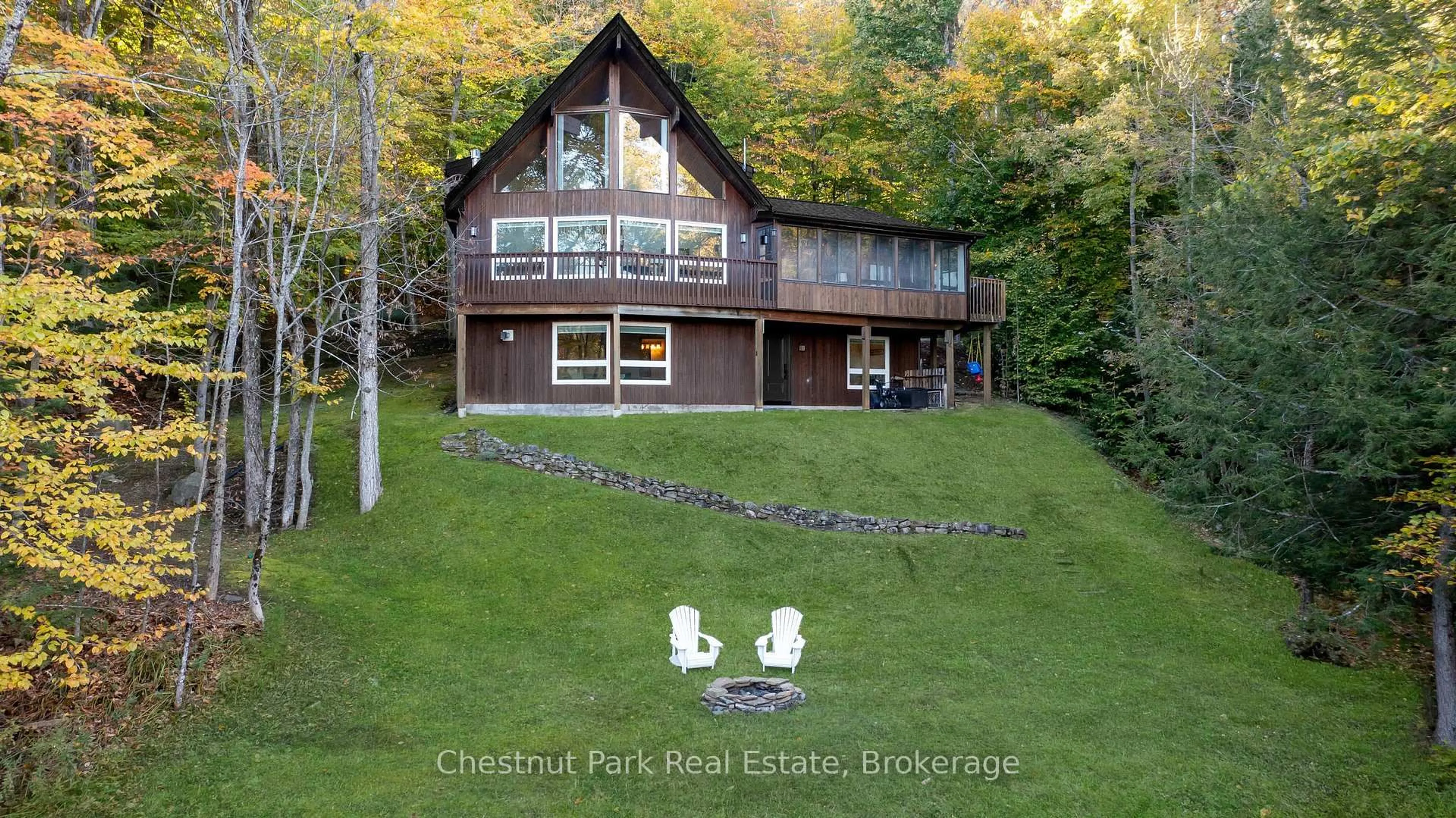 A pic from outside/outdoor area/front of a property/back of a property/a pic from drone, water/lake/river/ocean view for 1033 Point Ideal Rd, Lake of Bays Ontario P0A 1H0