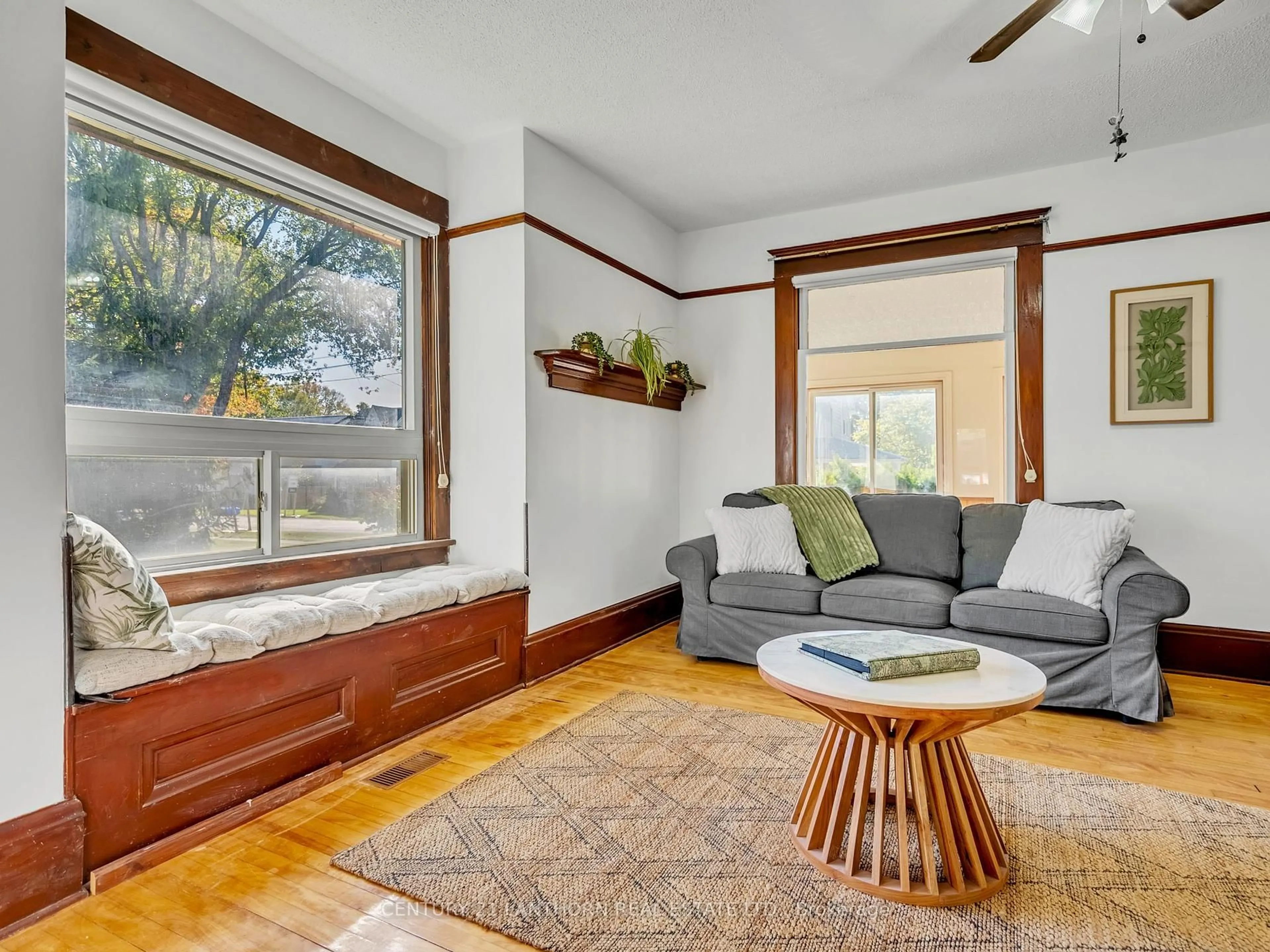 Living room with furniture, wood/laminate floor for 49 Consecon St, Prince Edward County Ontario K0K 3L0