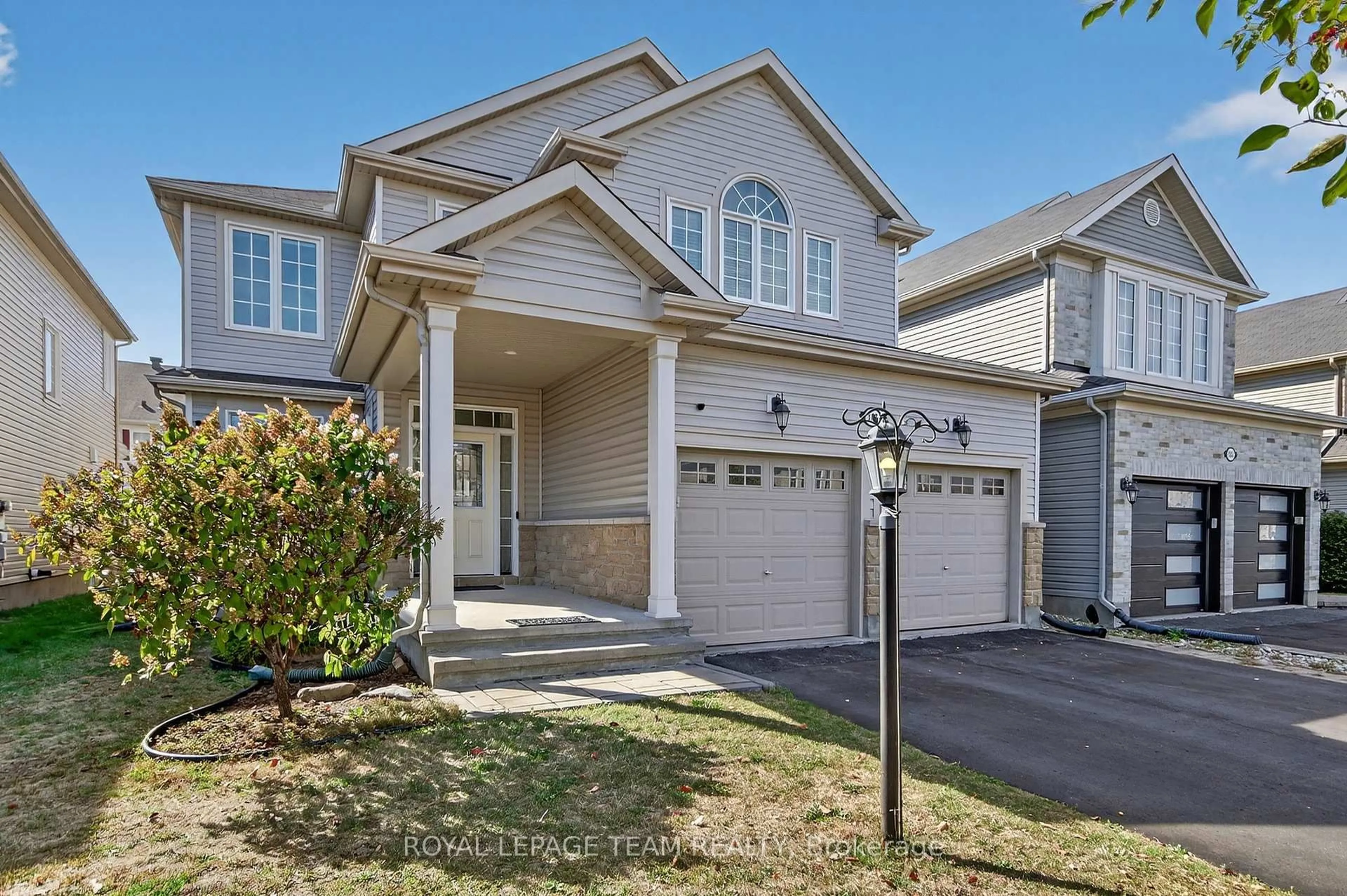 Home with vinyl exterior material, street for 347 Tucana Way, Ottawa Ontario K2J 0Z8