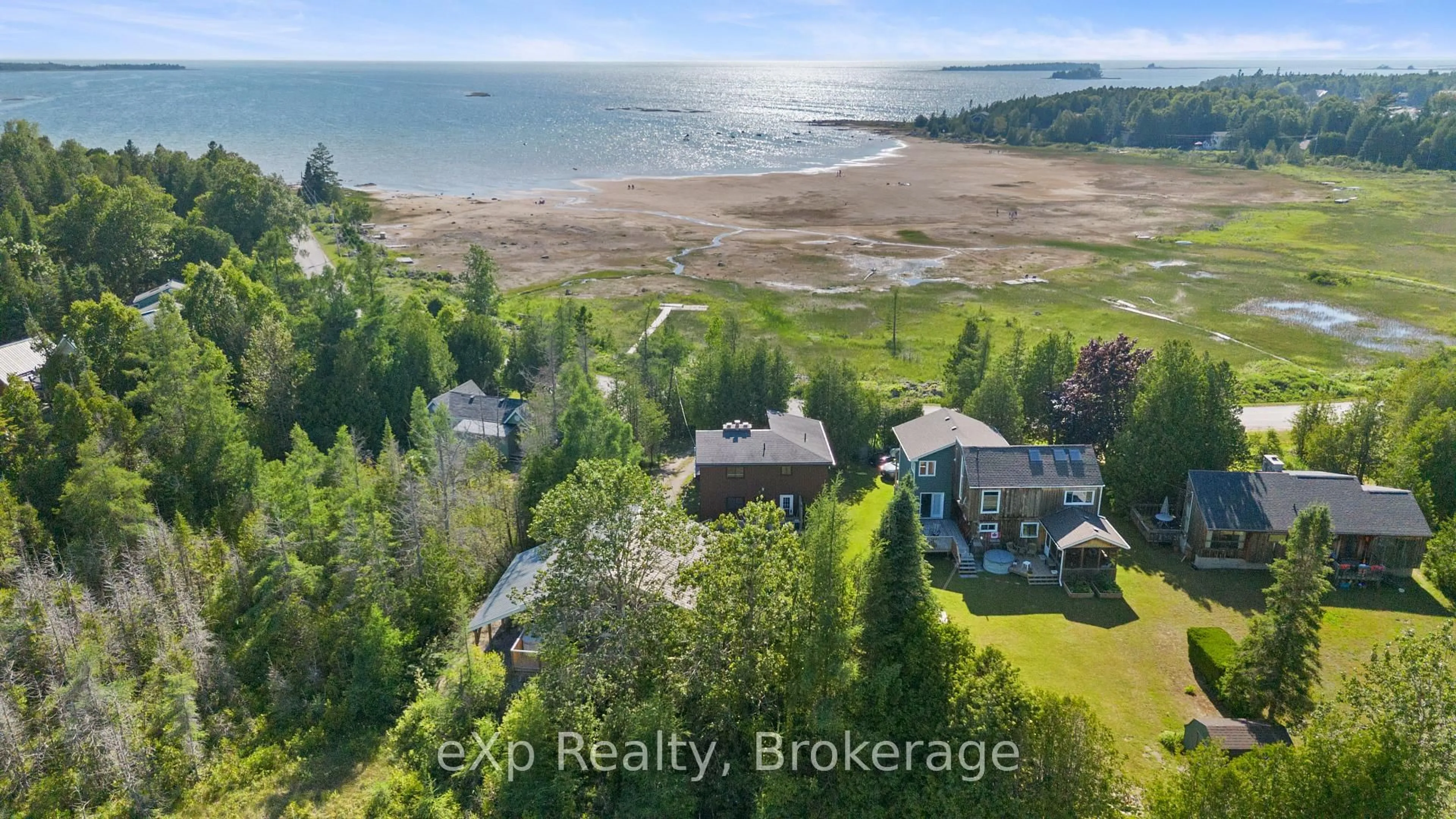A pic from outside/outdoor area/front of a property/back of a property/a pic from drone, water/lake/river/ocean view for 329 Bay St, South Bruce Peninsula Ontario N0H 2T0