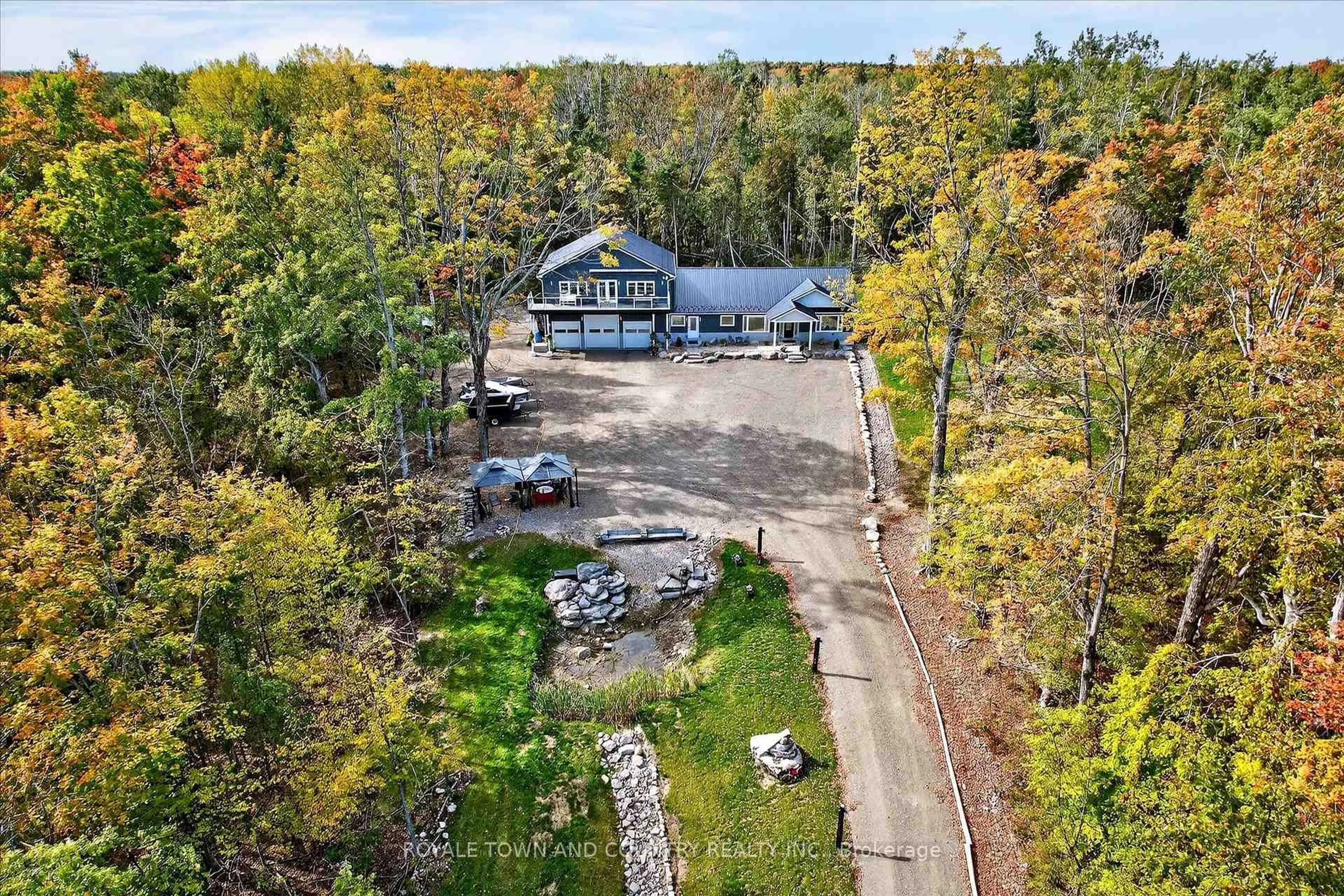 A pic from outside/outdoor area/front of a property/back of a property/a pic from drone, forest/trees view for 9 Lytle Lane, Kawartha Lakes Ontario K0M 2B0