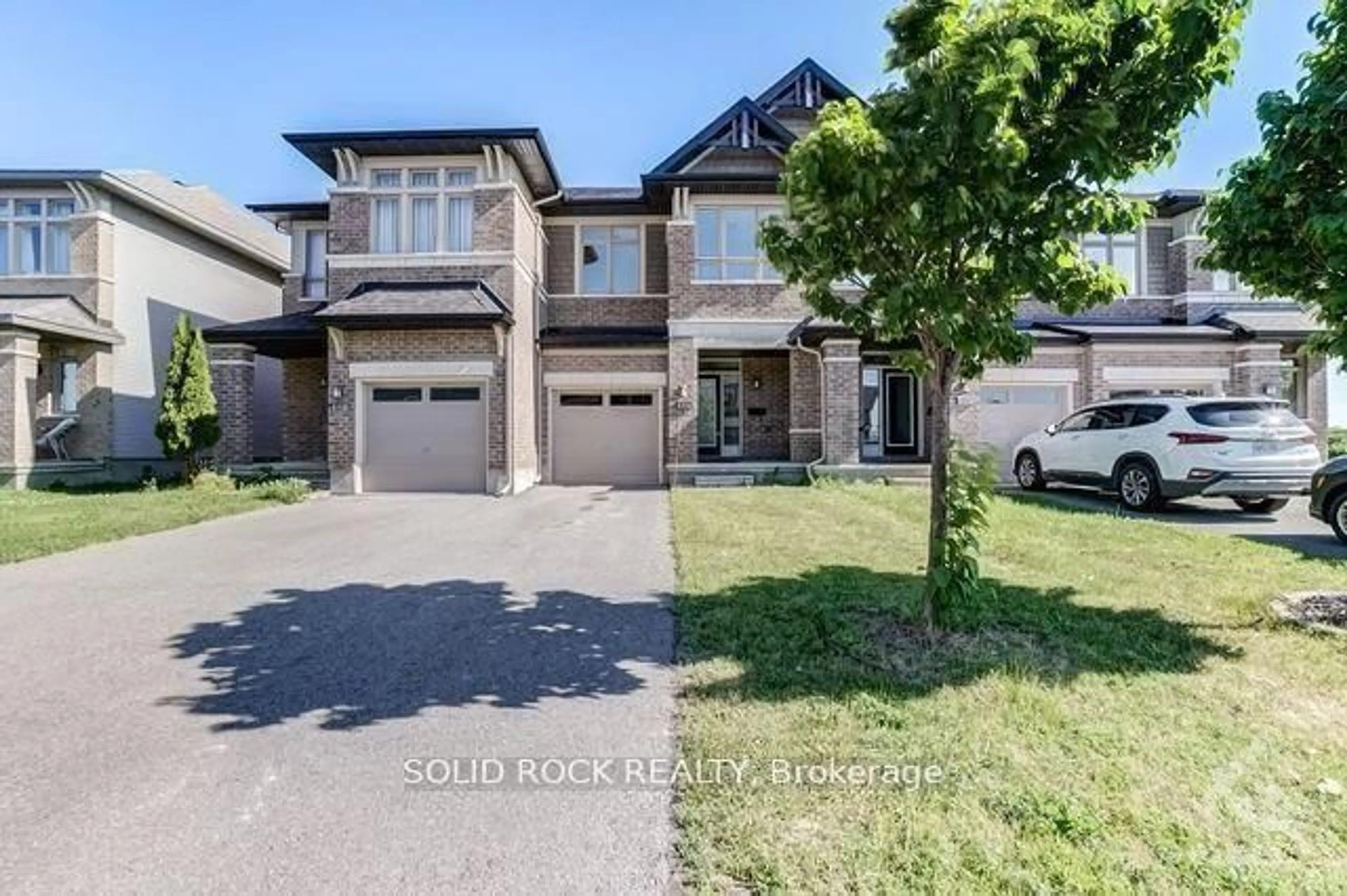 Home with brick exterior material, street for 604 Tennant Way, Ottawa Ontario K4M 0C6