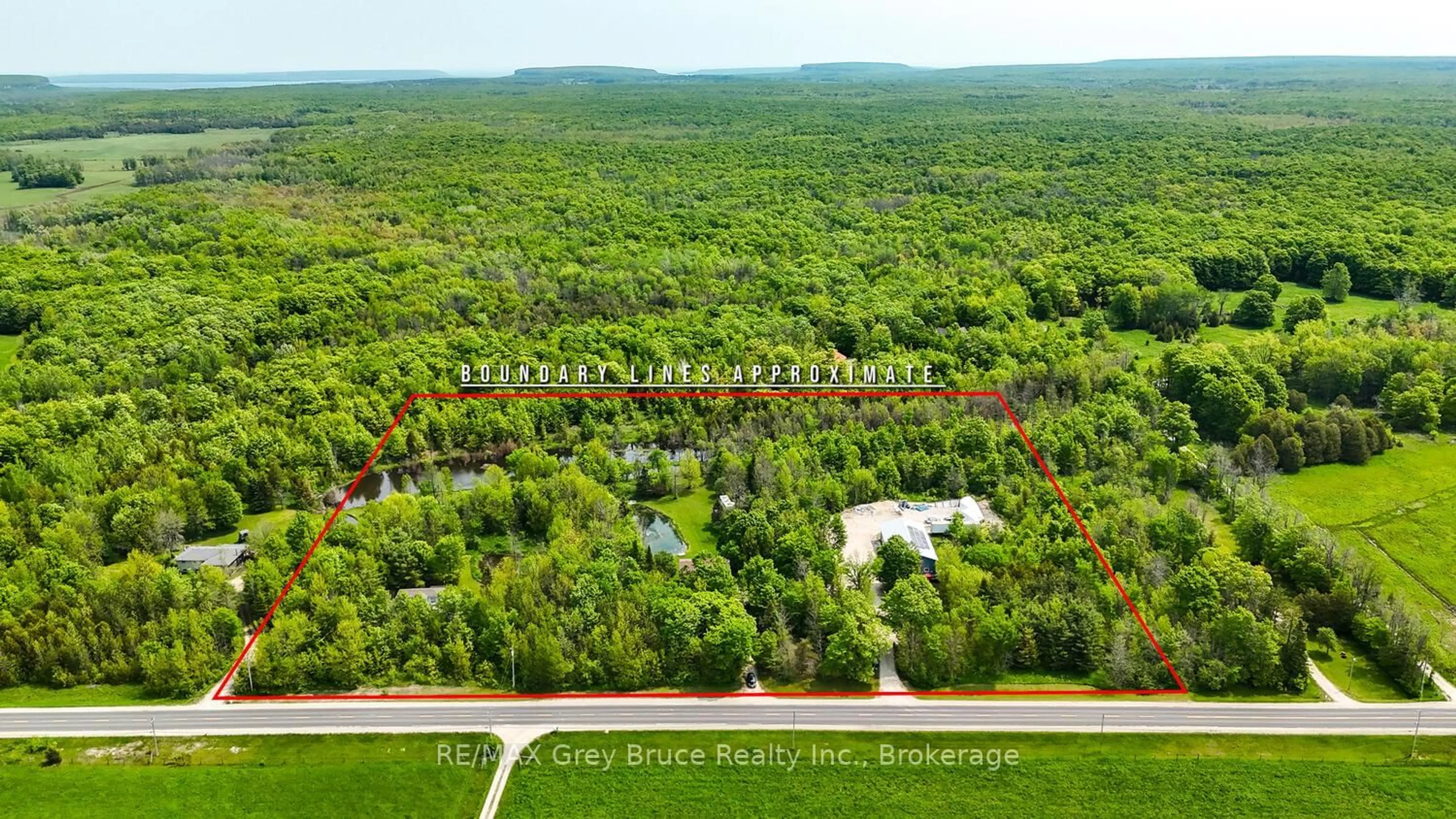 A pic from outside/outdoor area/front of a property/back of a property/a pic from drone, forest/trees view for 1033 Bruce Road 9, South Bruce Peninsula Ontario N0H 2T0