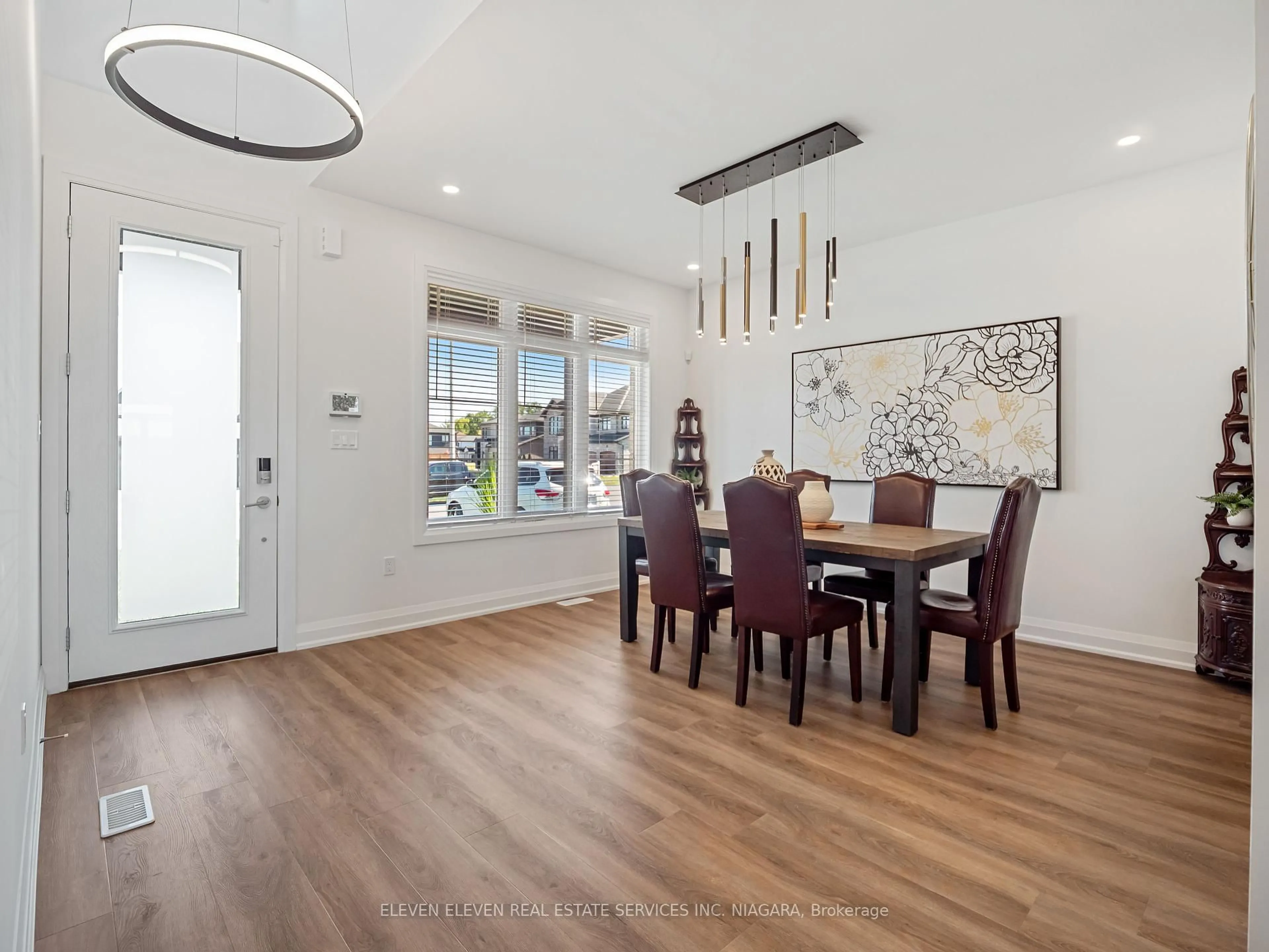 Dining room, wood/laminate floor for 7483 Sherrilee Cres, Niagara Falls Ontario L2H 3T4