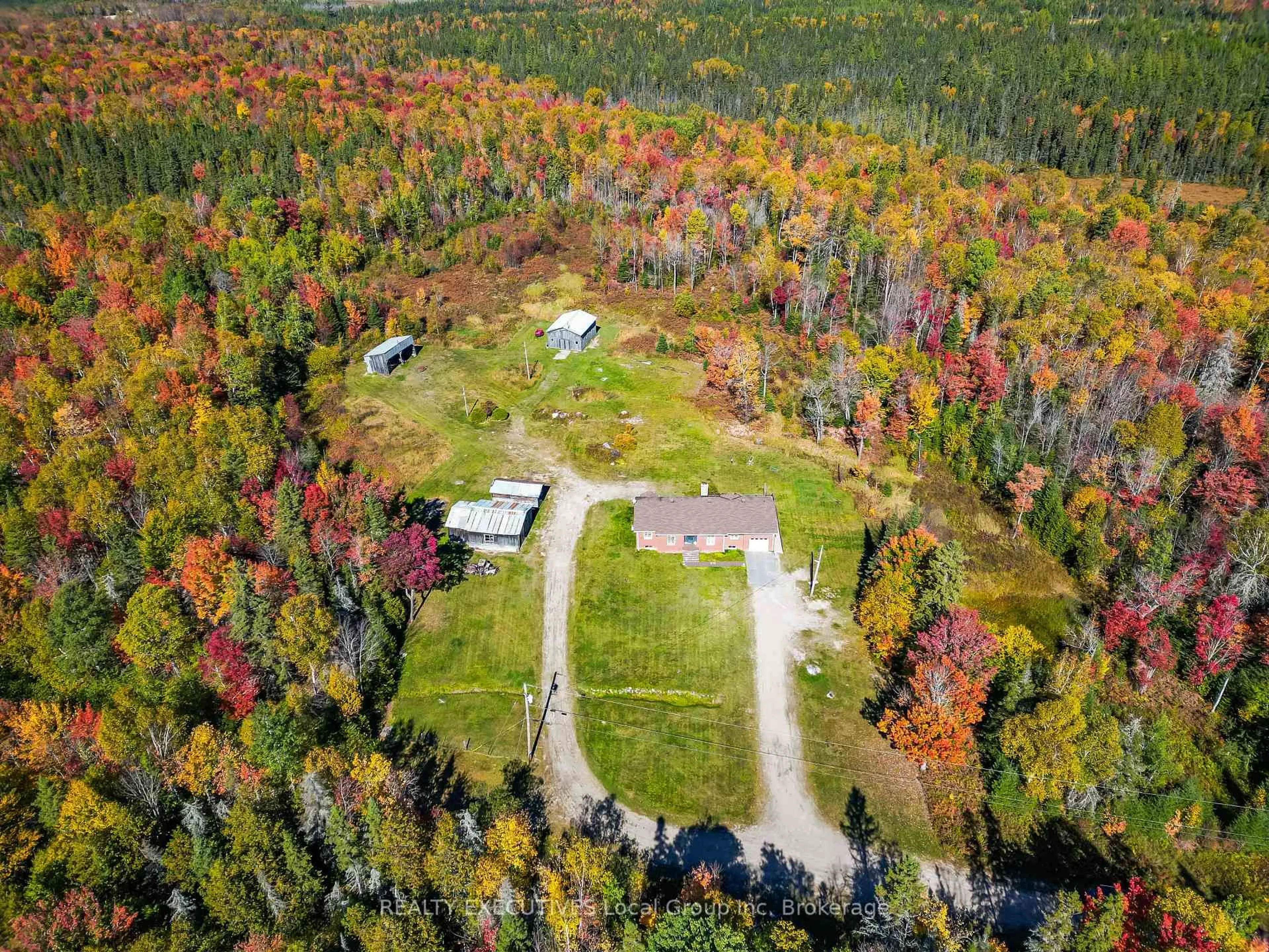 A pic from outside/outdoor area/front of a property/back of a property/a pic from drone, forest/trees view for 400 Bomarc Rd, North Bay Ontario P1B 8G3