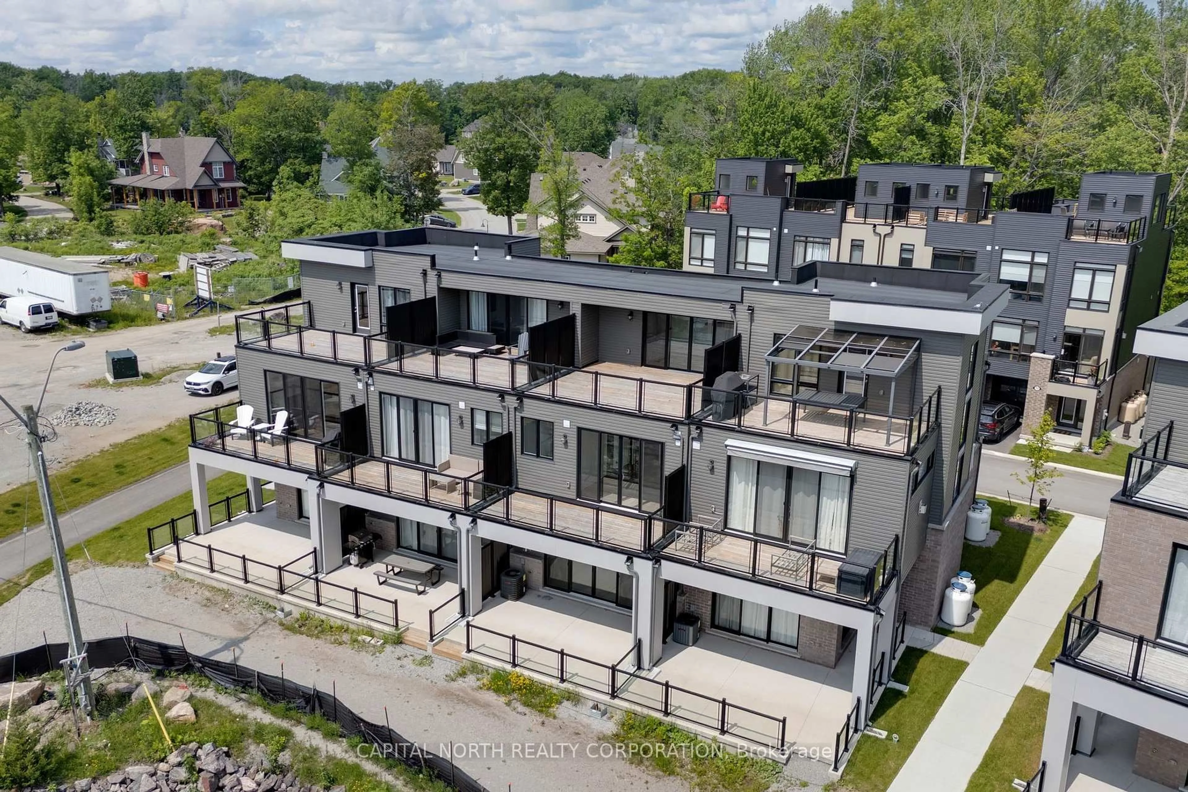 A pic from outside/outdoor area/front of a property/back of a property/a pic from drone, building for 74 Marina Village Dr, Georgian Bay Ontario L0K 1S0