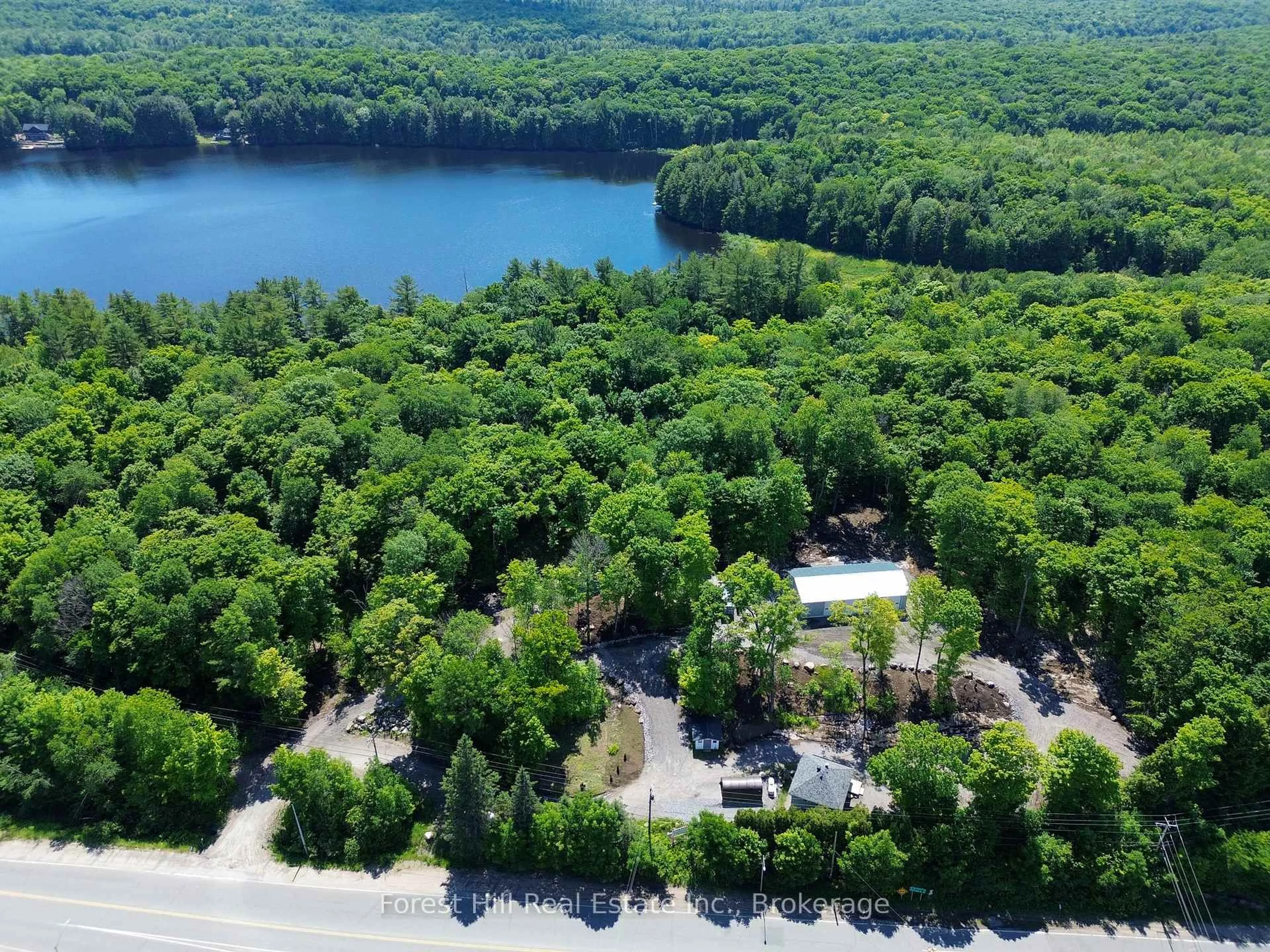 A pic from outside/outdoor area/front of a property/back of a property/a pic from drone, water/lake/river/ocean view for 4061 Muskoka Rd 169 Highway, Muskoka Lakes Ontario P0B 1J0