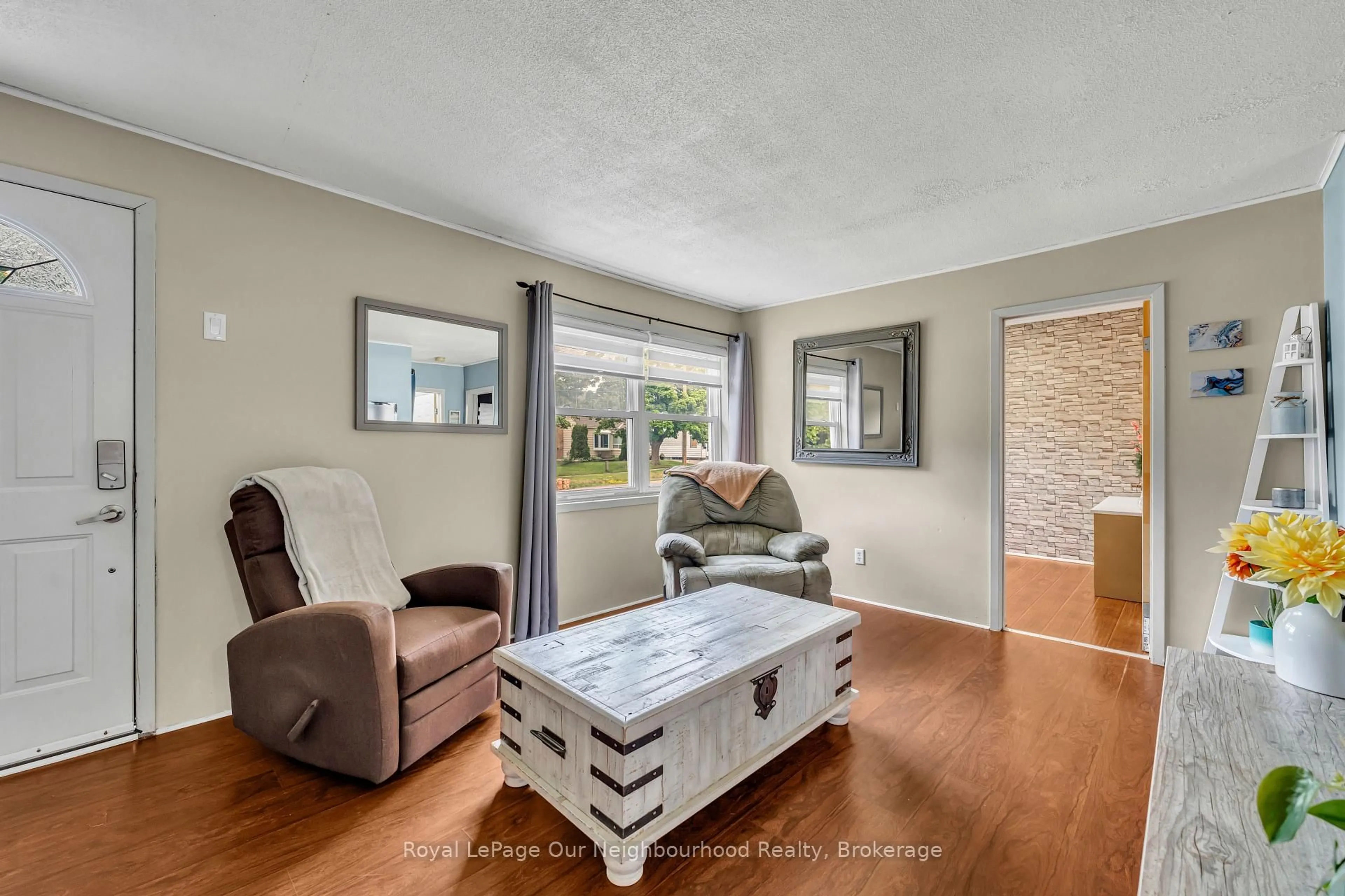 Living room with furniture, wood/laminate floor for 21 Lavinia St, Port Hope Ontario L1A 2A5