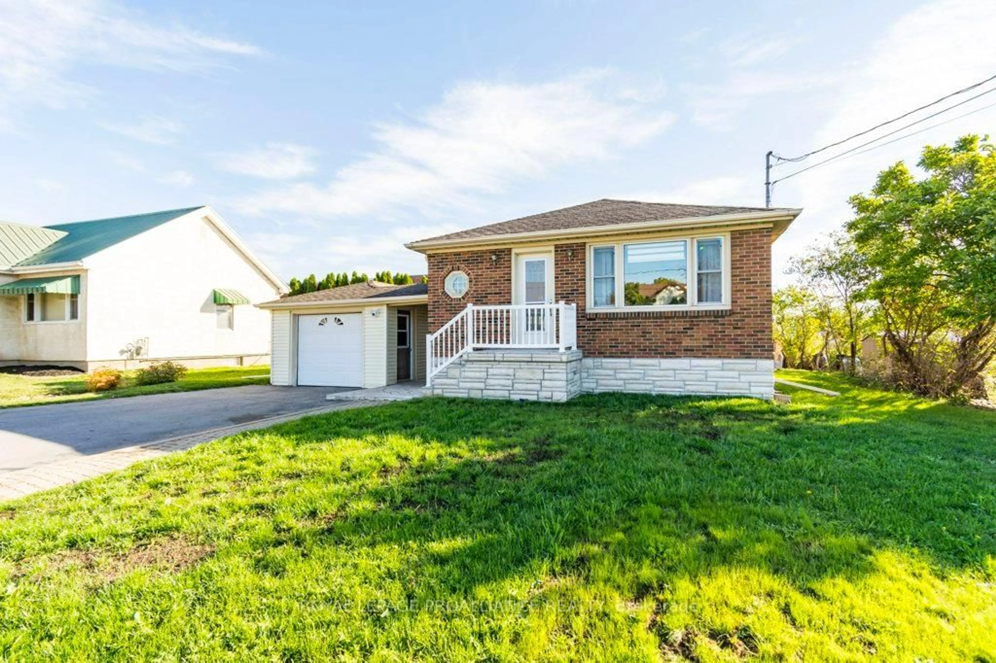 Home with vinyl exterior material, street for 18 Holmes Rd, Belleville Ontario K8P 4G6