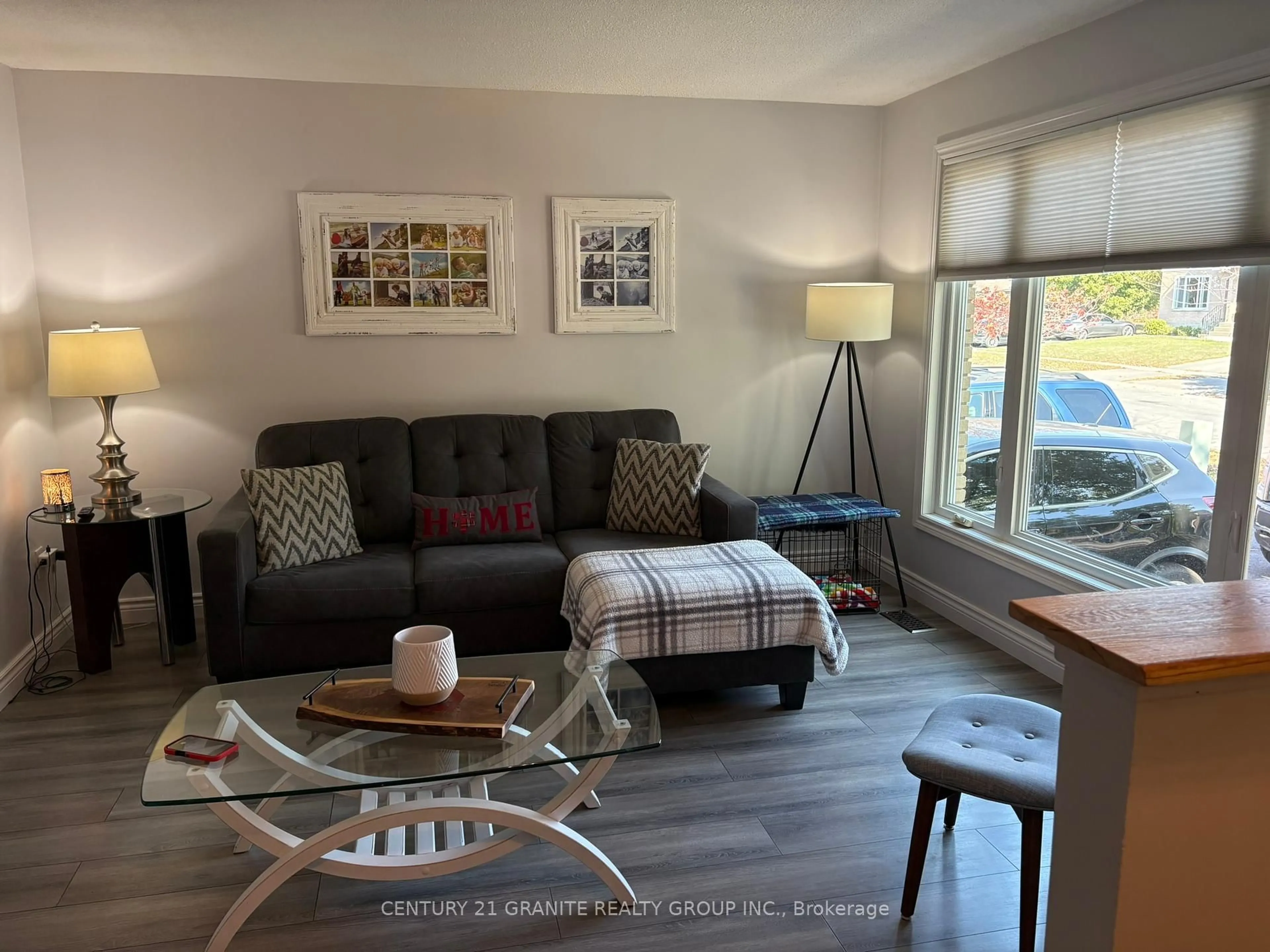 Living room with furniture, wood/laminate floor for 1019 Sprucewood Cres, Kingston Ontario K7P 1N1
