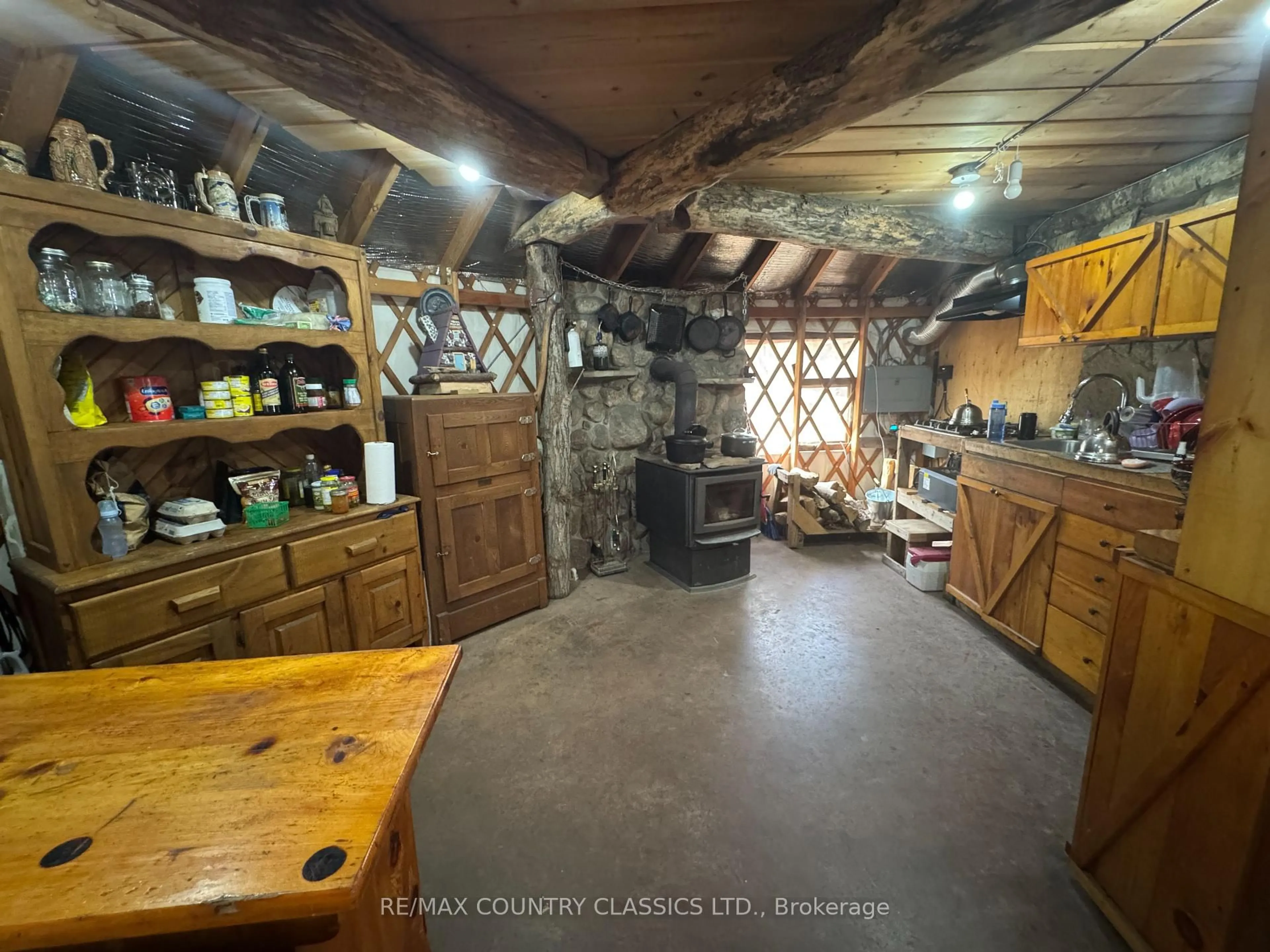 Rustic kitchen, cement floor for 102 Caroline Crt, Bancroft Ontario K0L 1C0