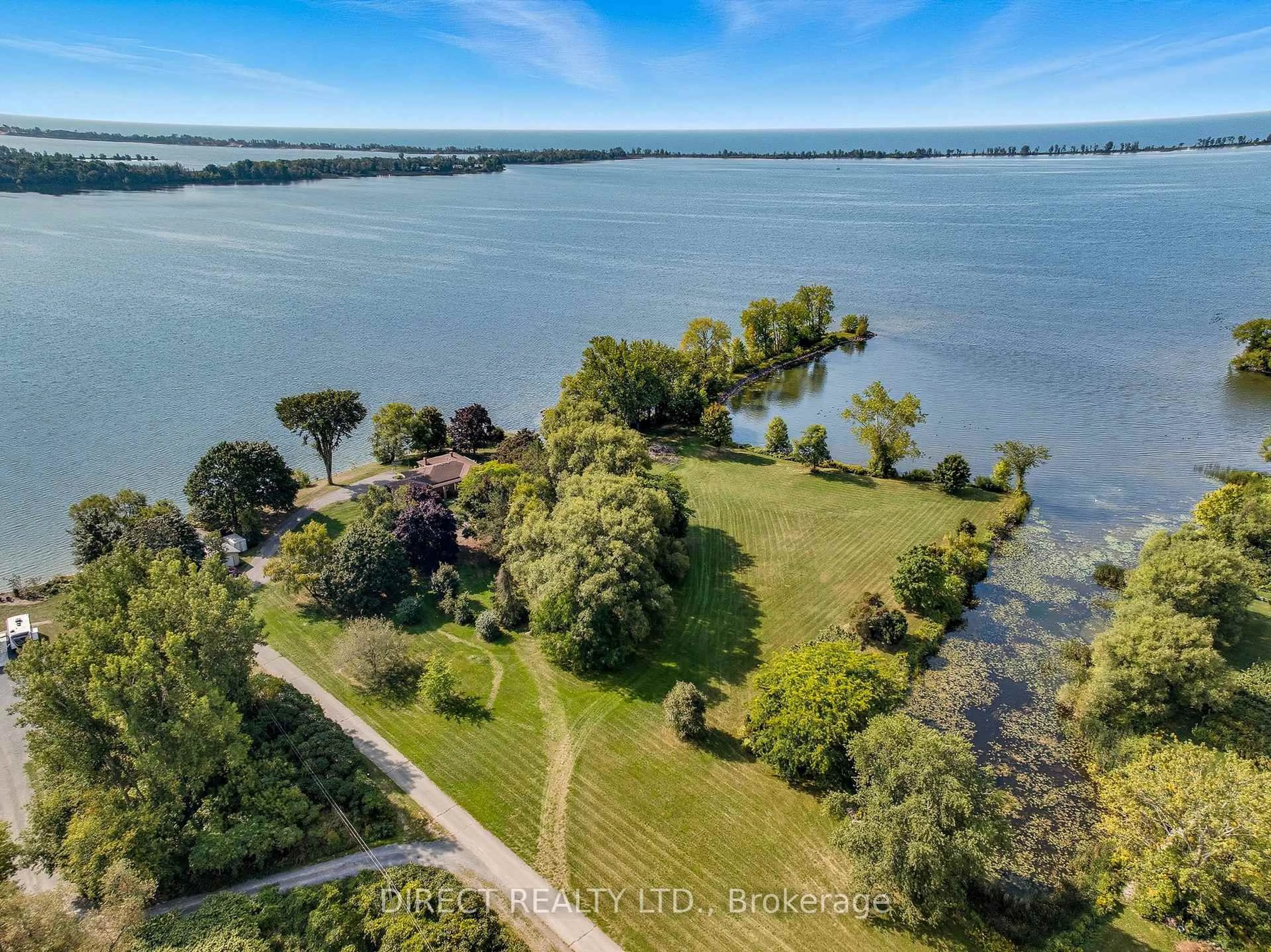 A pic from outside/outdoor area/front of a property/back of a property/a pic from drone, water/lake/river/ocean view for 15753 Loyalist Pkwy, Prince Edward County Ontario K0K 1G0