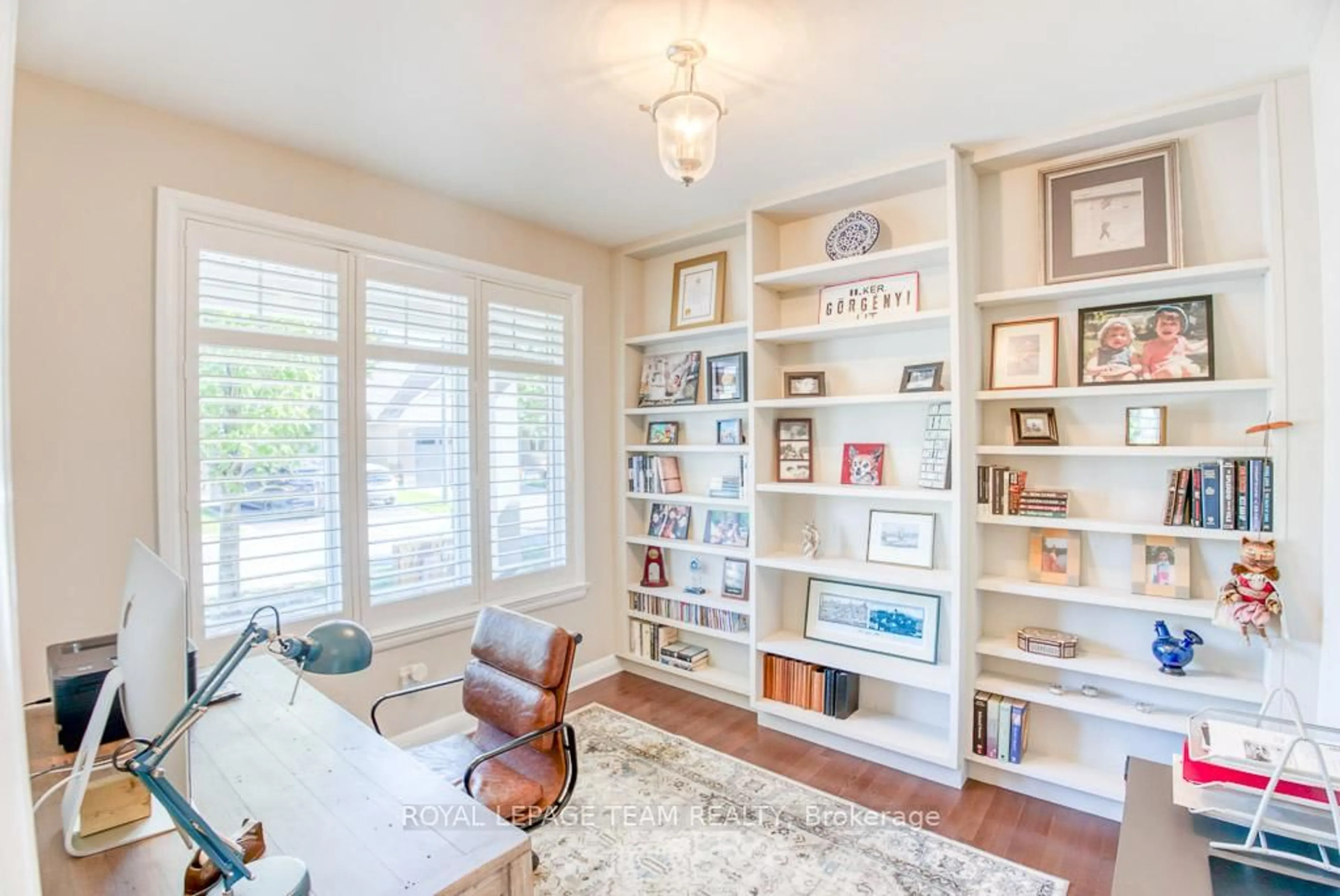Living room with furniture, wood/laminate floor for 107 Kitsilano Crt, Ottawa Ontario K2H 0B5