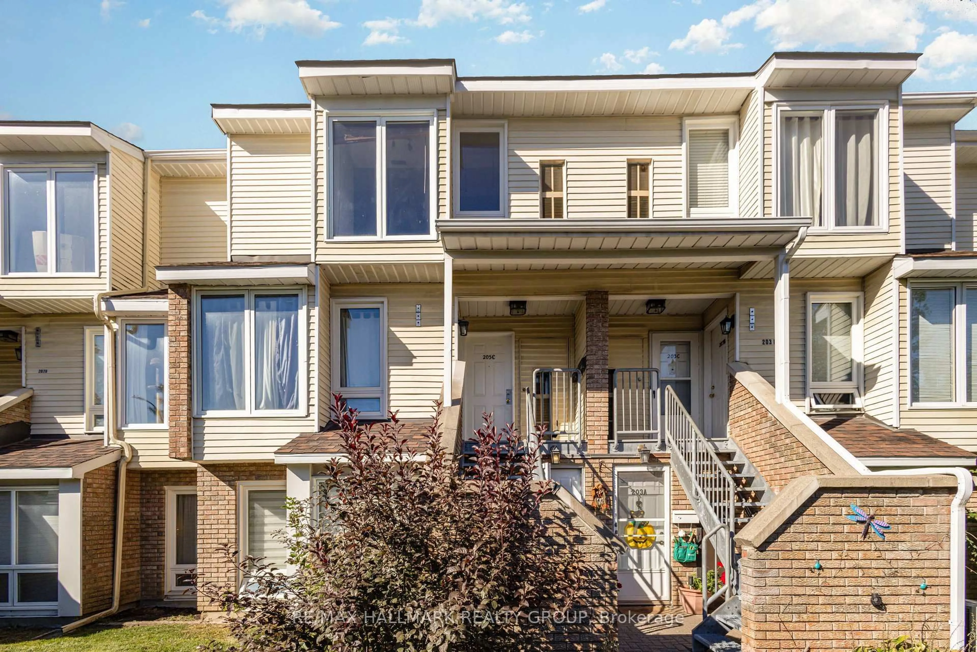 Home with vinyl exterior material, street for 205 Woodfield Dr #C, Ottawa Ontario K2G 4P2