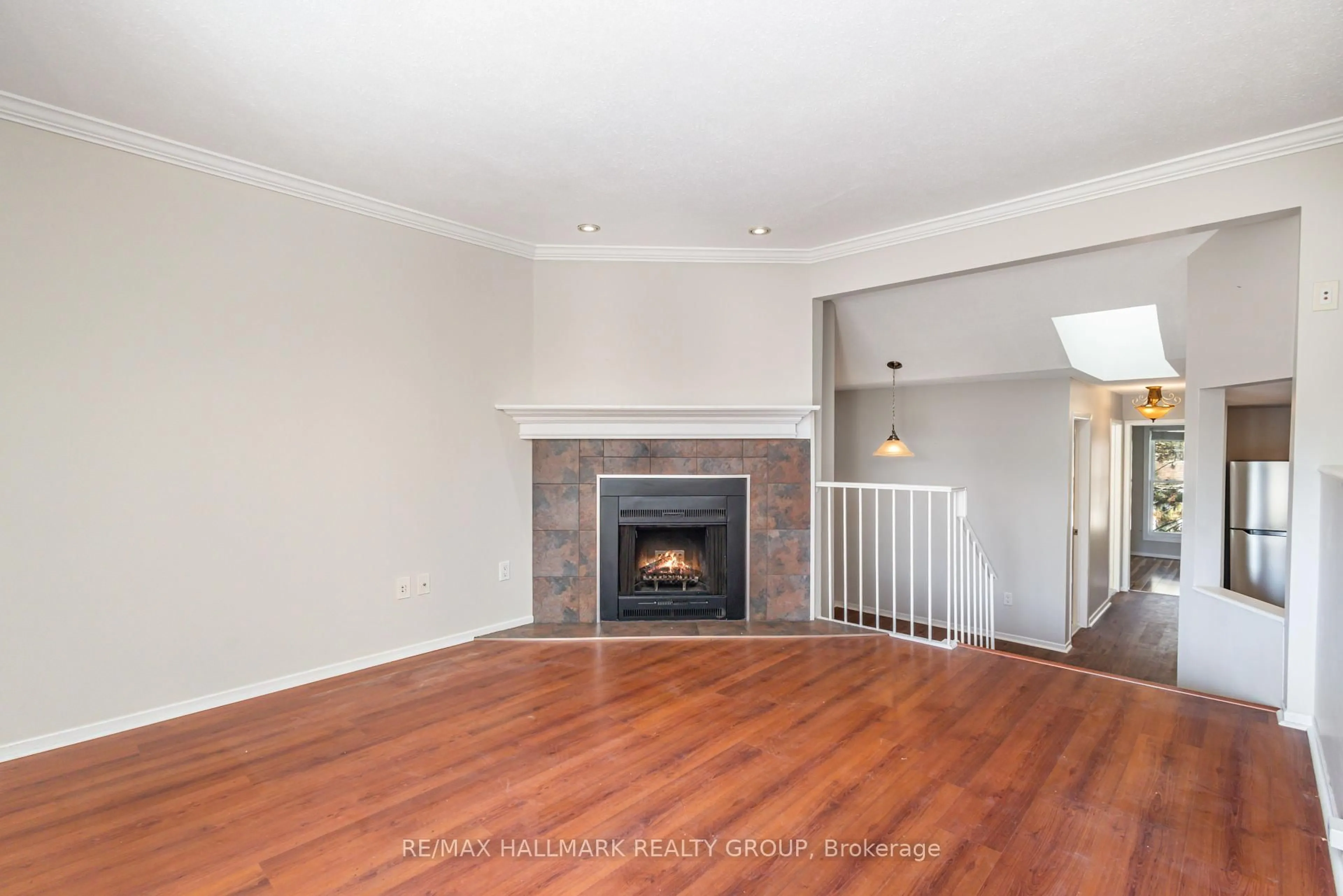 Living room with furniture, wood/laminate floor for 205 Woodfield Dr #C, Ottawa Ontario K2G 4P2