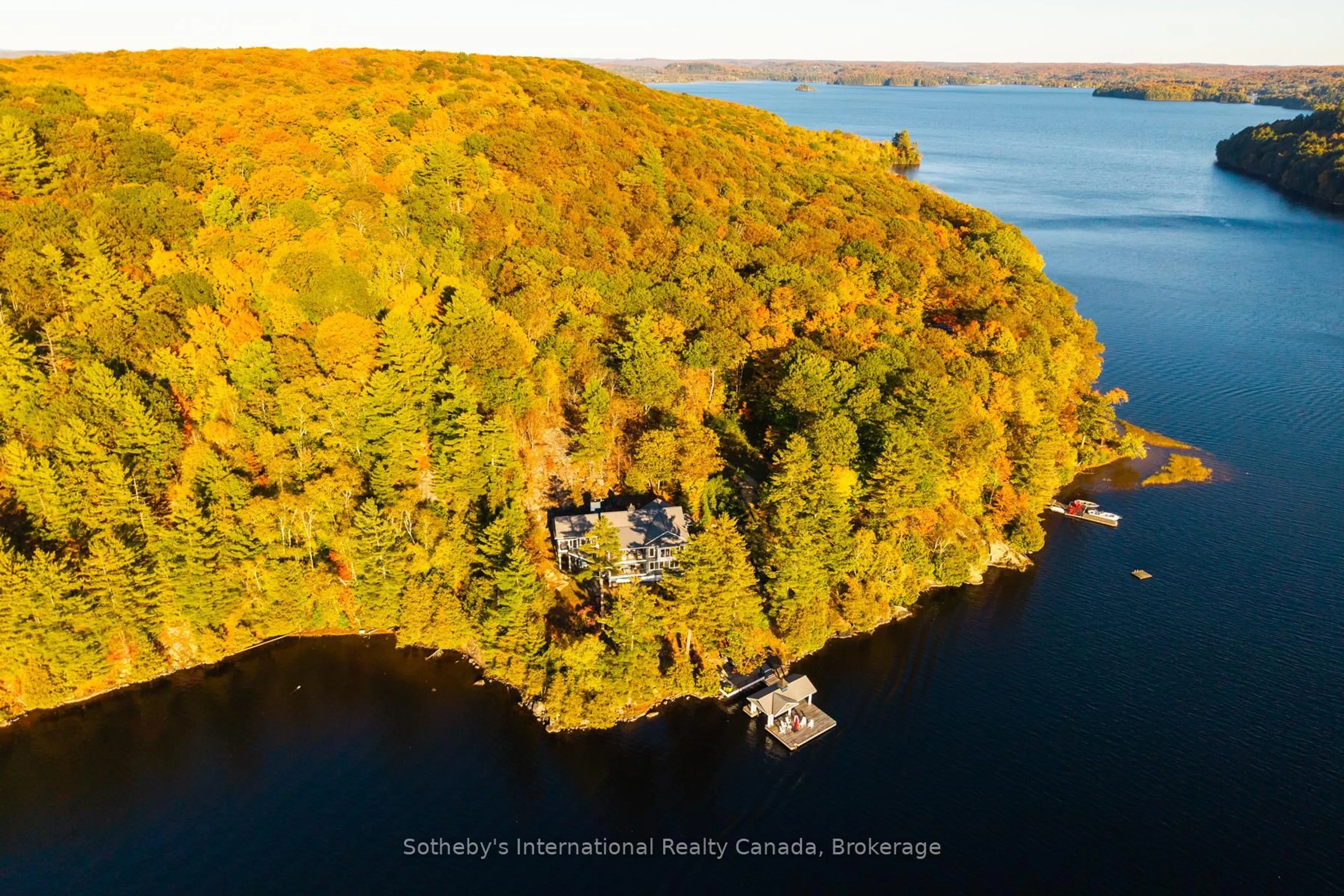 A pic from outside/outdoor area/front of a property/back of a property/a pic from drone, water/lake/river/ocean view for 800 Big Island Rd, Huntsville Ontario P1H 2J2