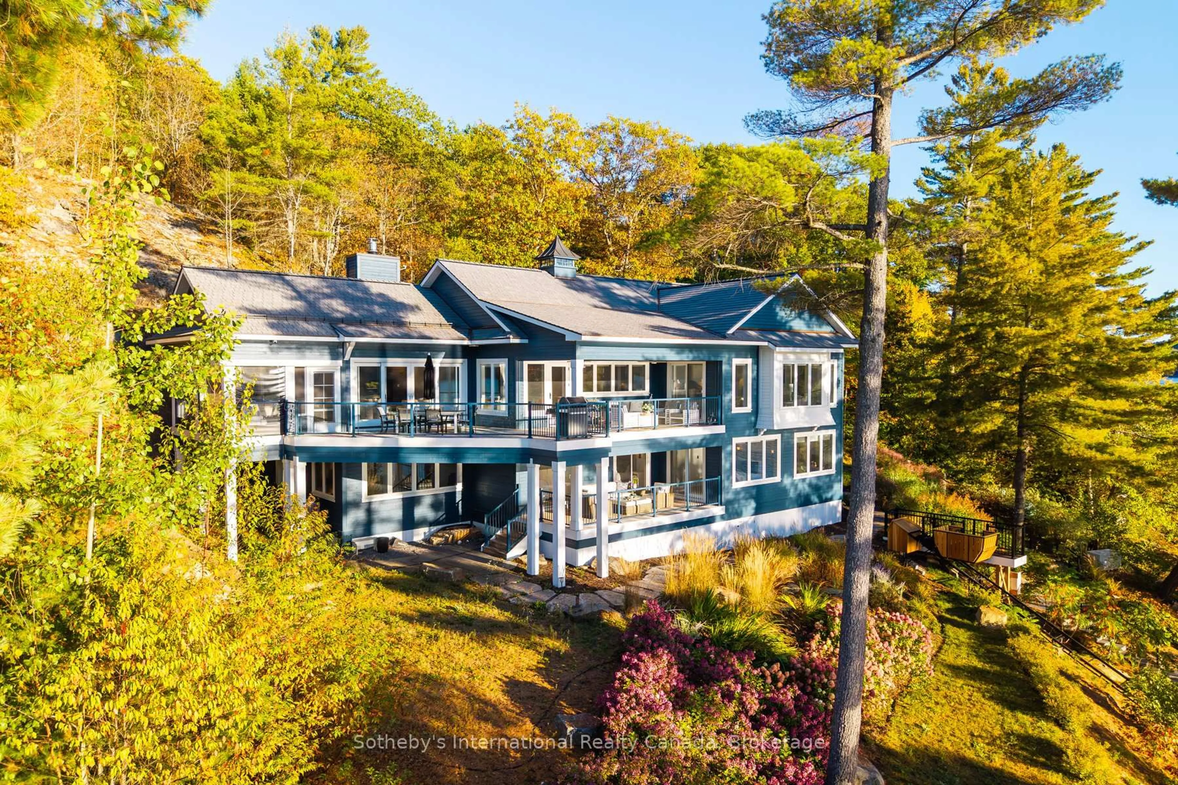 A pic from outside/outdoor area/front of a property/back of a property/a pic from drone, water/lake/river/ocean view for 800 Big Island Rd, Huntsville Ontario P1H 2J2