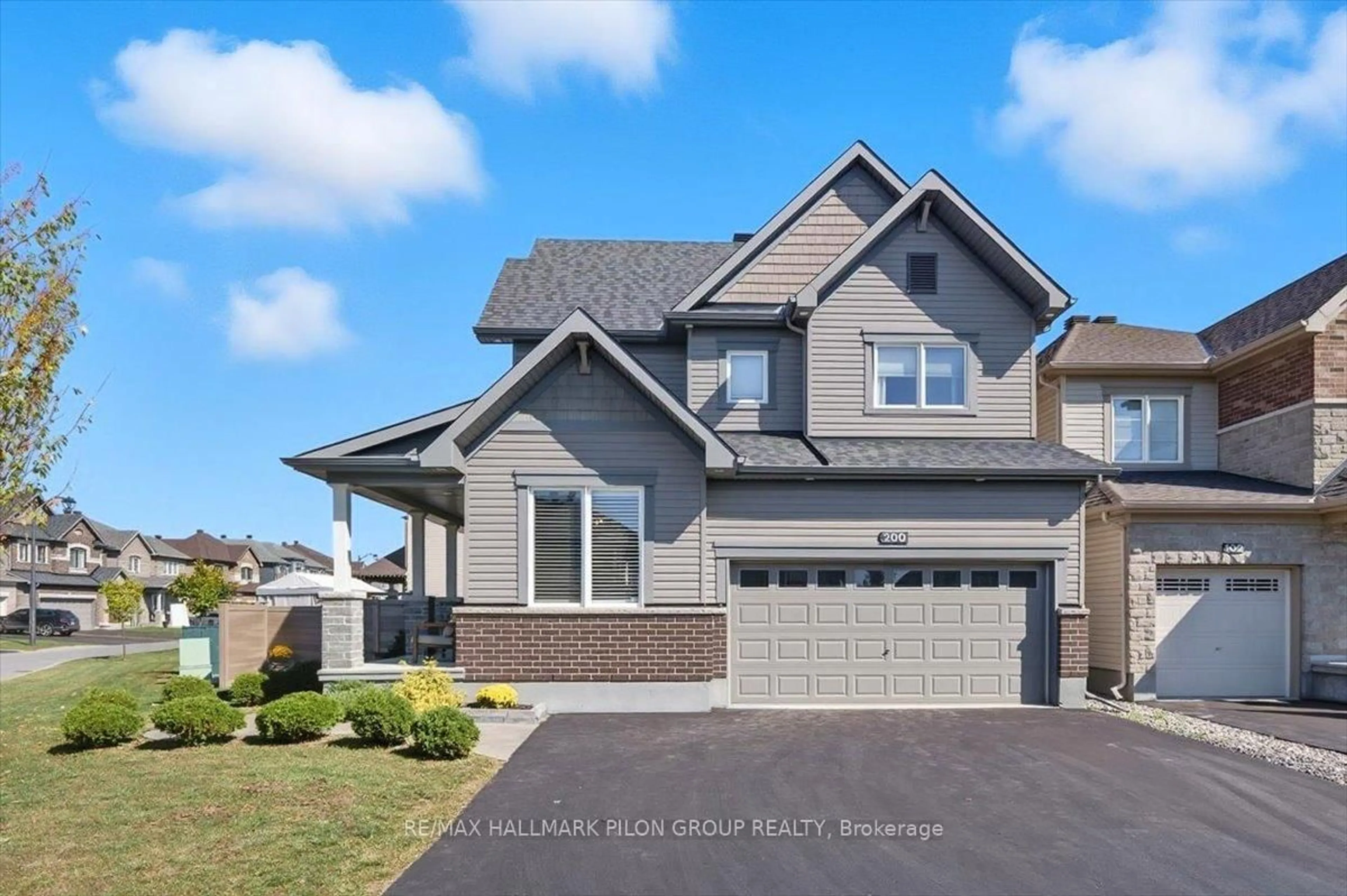 Home with vinyl exterior material, street for 200 Enclave Walk, Ottawa Ontario K1W 0J4