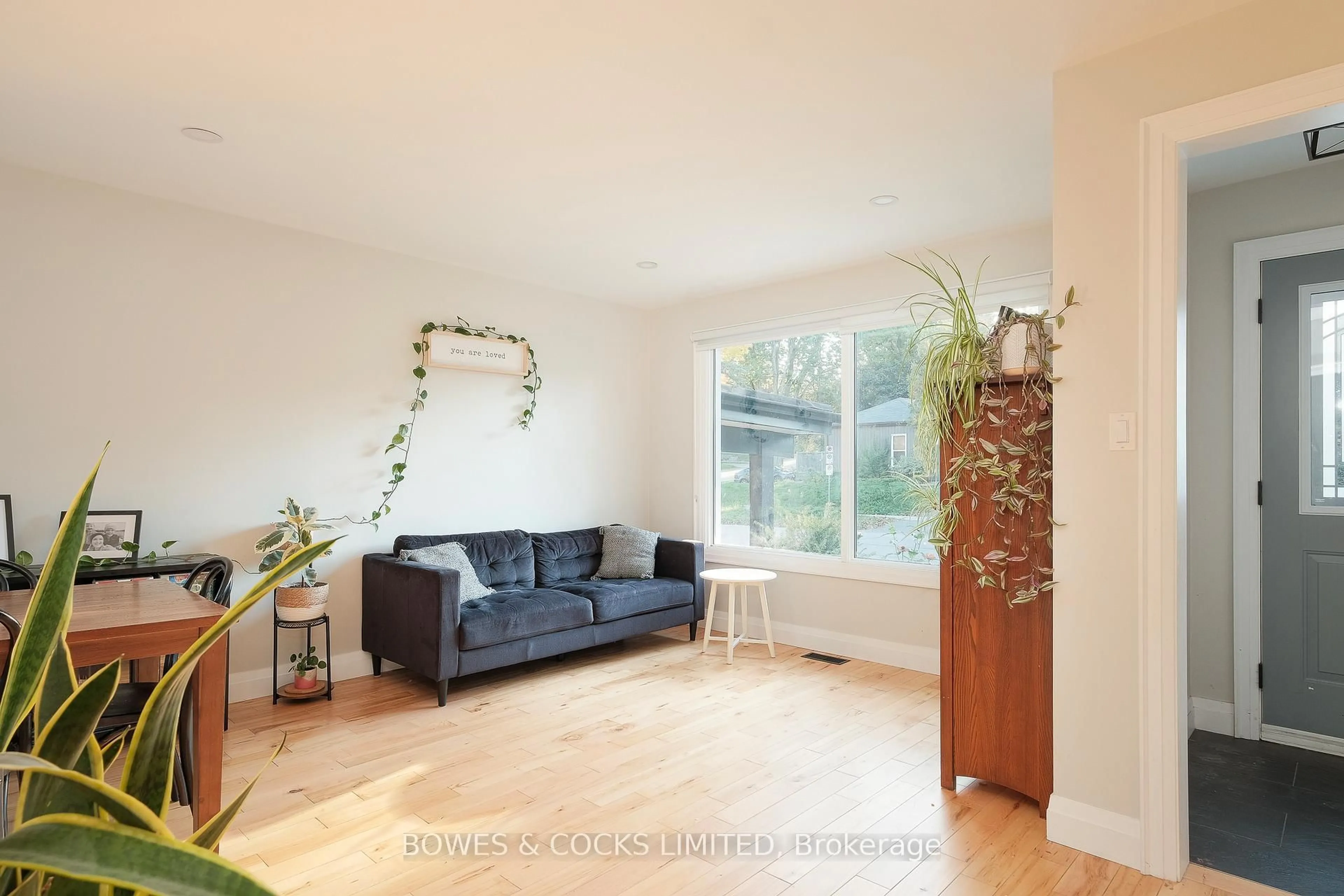 Living room with furniture, wood/laminate floor for 1462 Westbrook Dr, Peterborough Ontario K9J 6R4