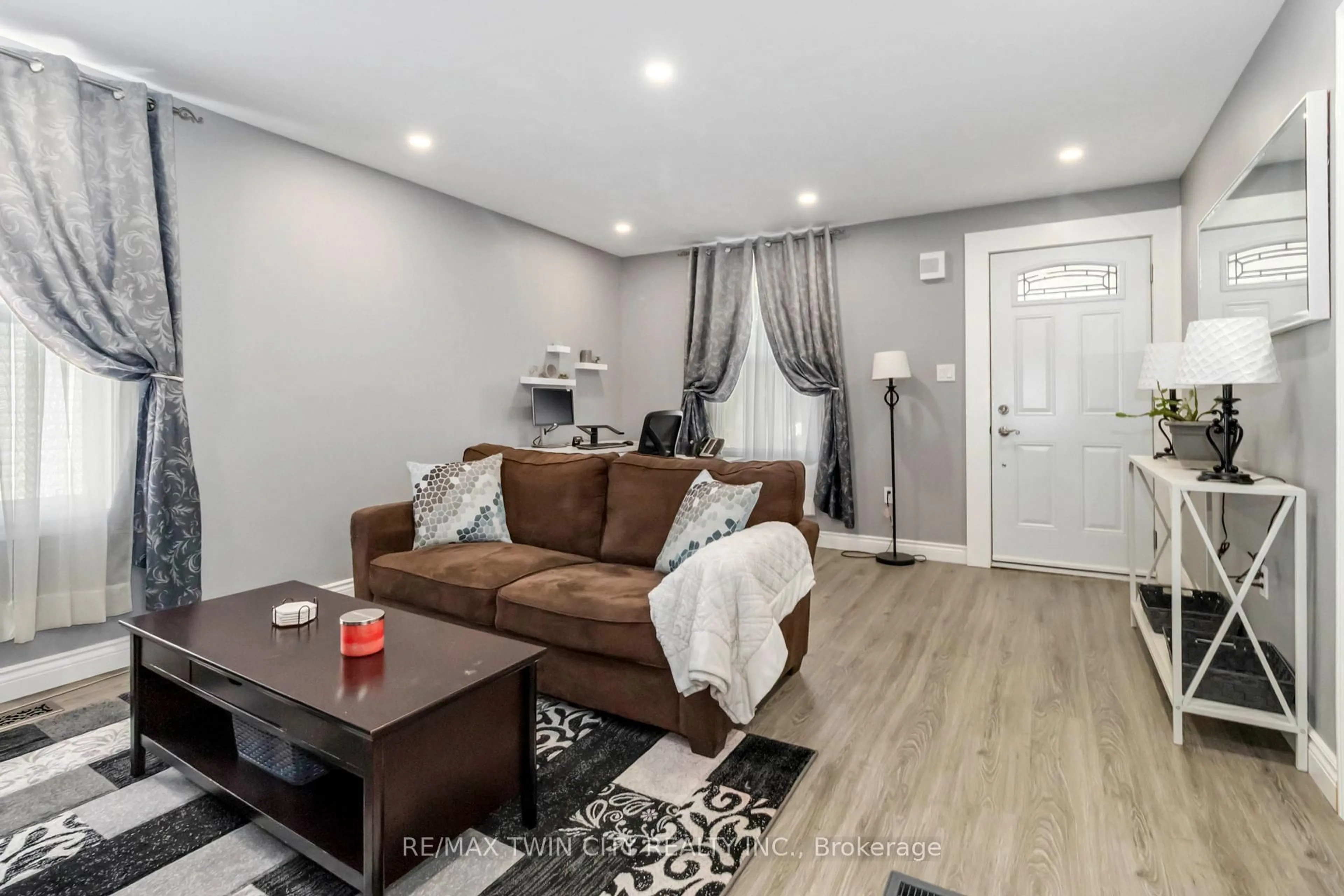 Living room with furniture, wood/laminate floor for 305 Dalhousie St, Brantford Ontario N3S 3V6