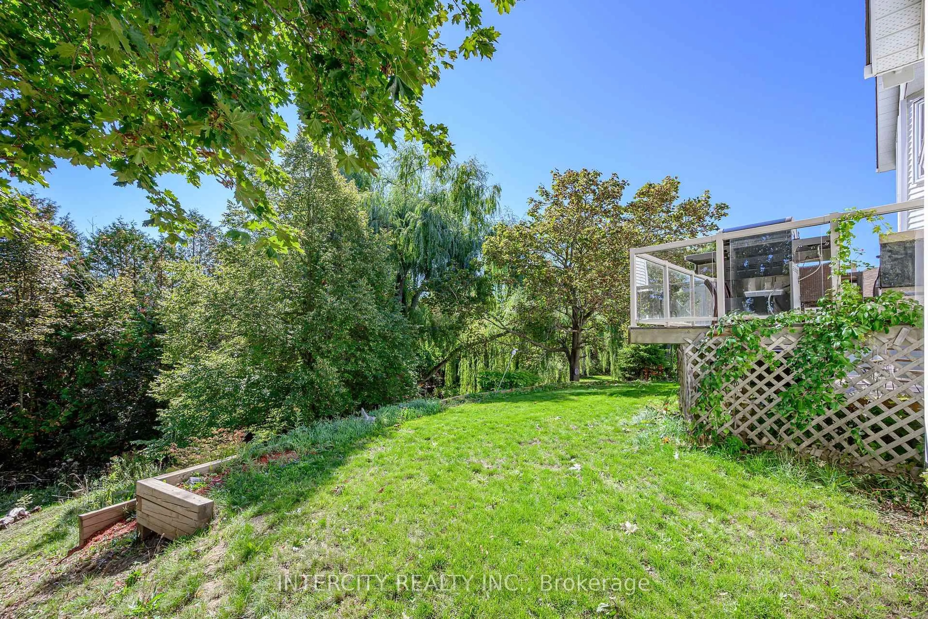 Patio, forest/trees view for 48 Champlain Blvd, Kawartha Lakes Ontario K9V 0J1