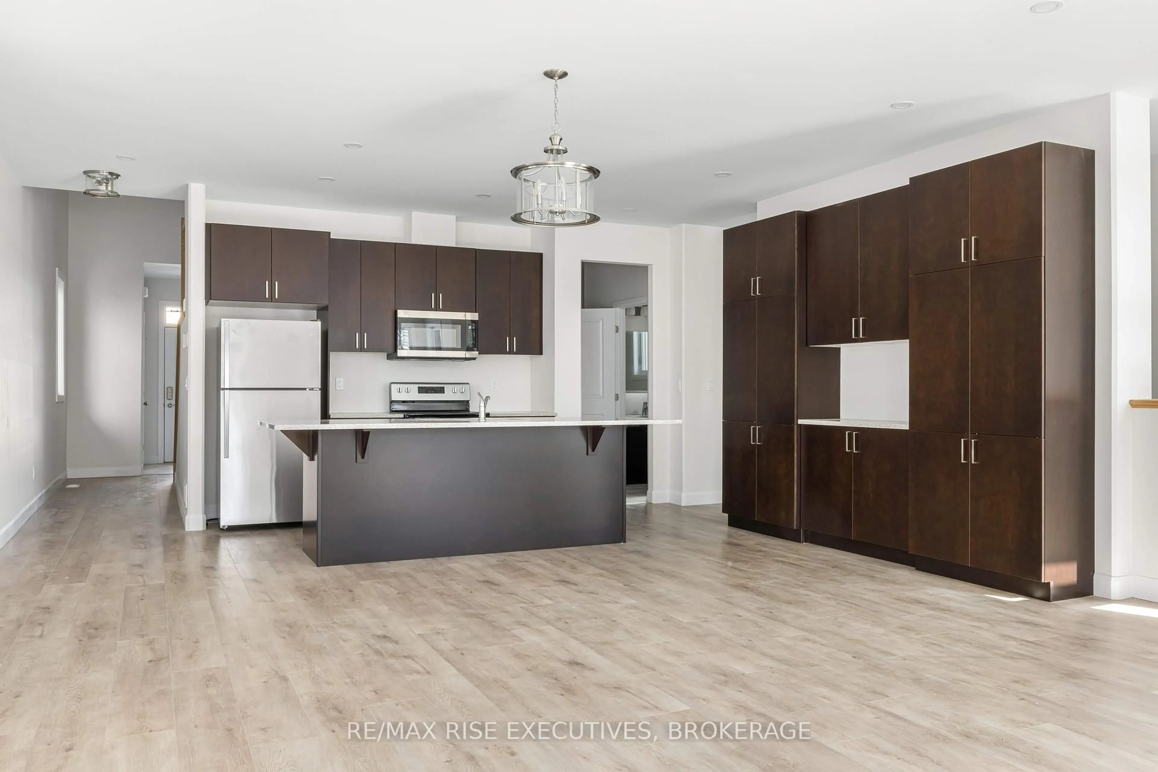 Open concept kitchen, wood/laminate floor for 32 Erie Crt, Loyalist Ontario K7N 0E3
