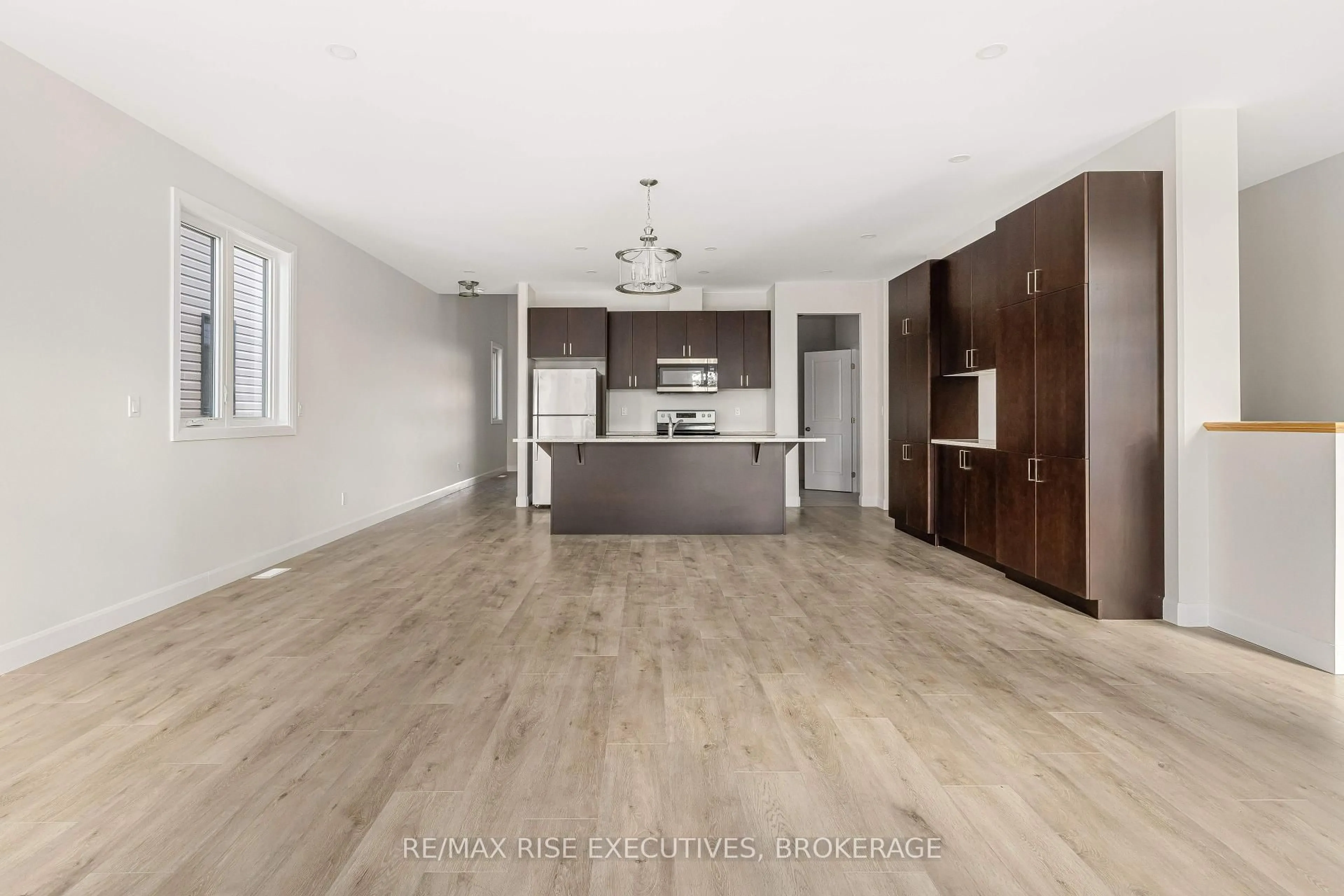 Open concept kitchen, wood/laminate floor for 32 Erie Crt, Loyalist Ontario K7N 0E3