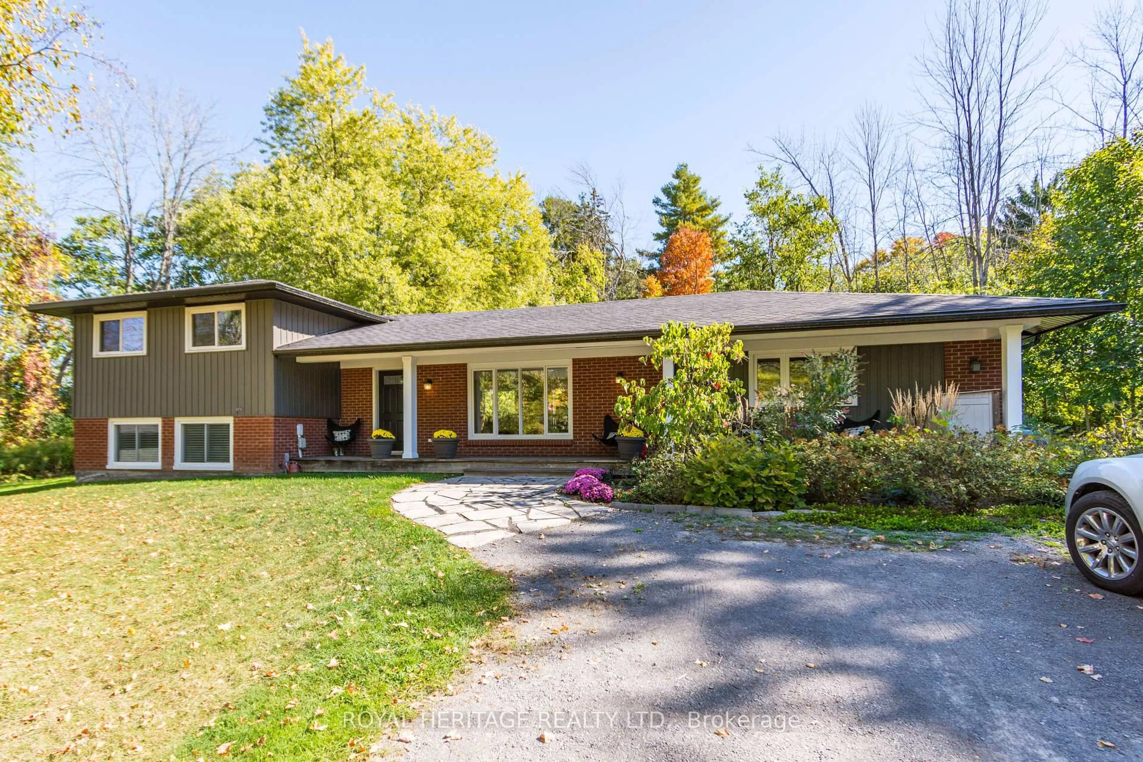 Home with vinyl exterior material, street for 32 Mallory Rd, Prince Edward County Ontario K0K 1G0