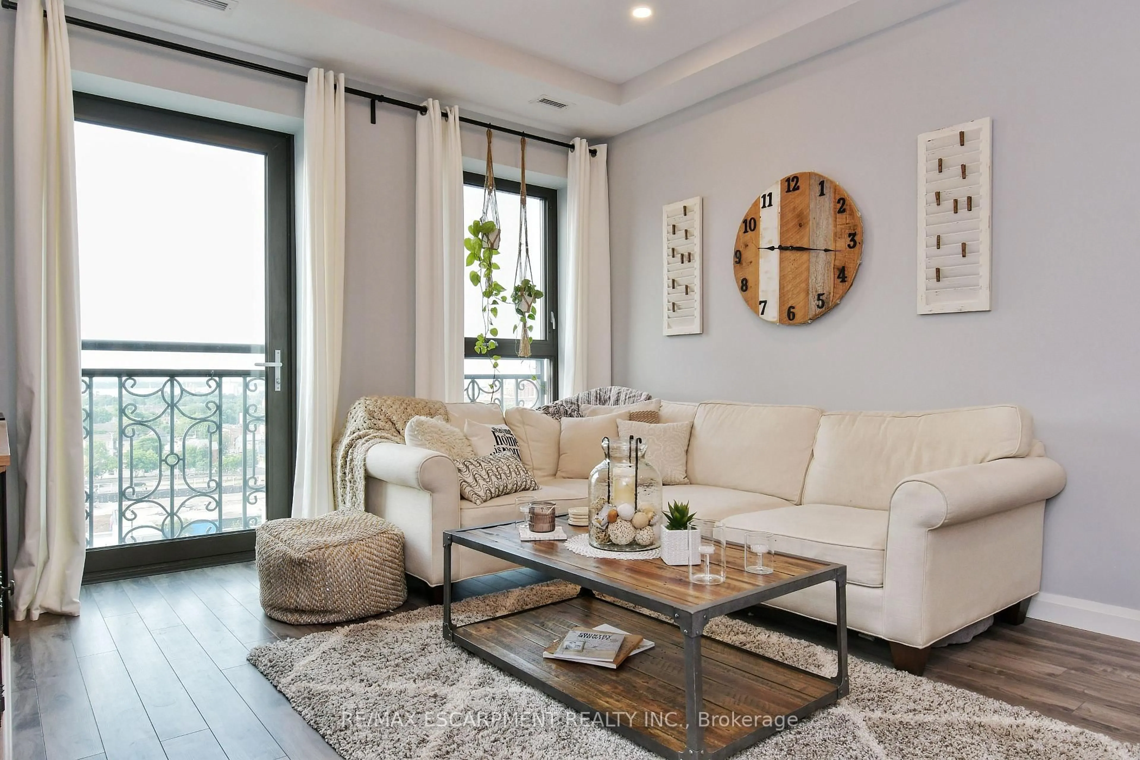 Living room with furniture, wood/laminate floor for 112 King St #903, Hamilton Ontario L8N 1A8