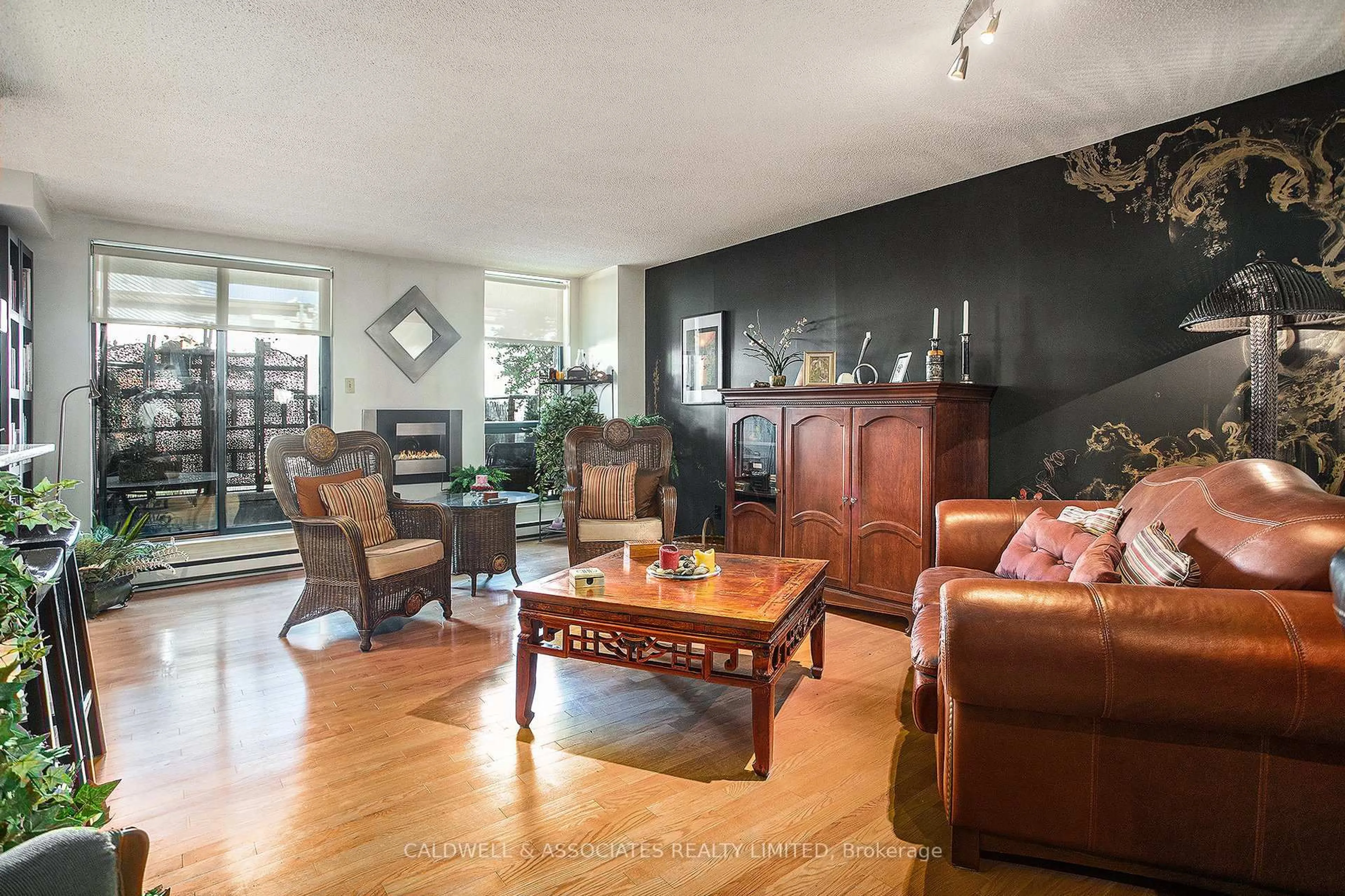 Living room with furniture, wood/laminate floor for 15 Murray St #104, Ottawa Ontario K1N 9M5