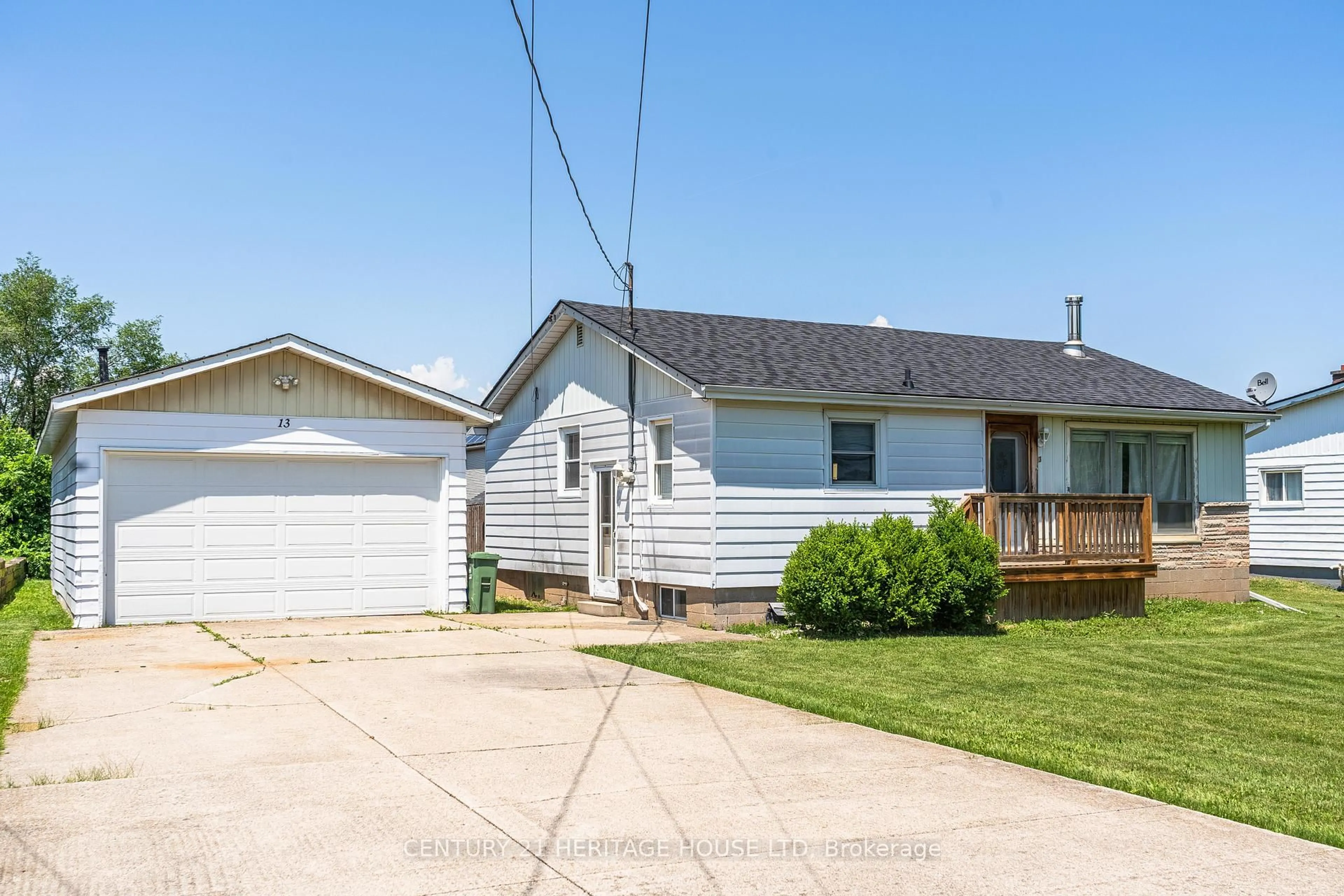 Home with vinyl exterior material, street for 13 West Ave, Hamilton Ontario L8E 5L5