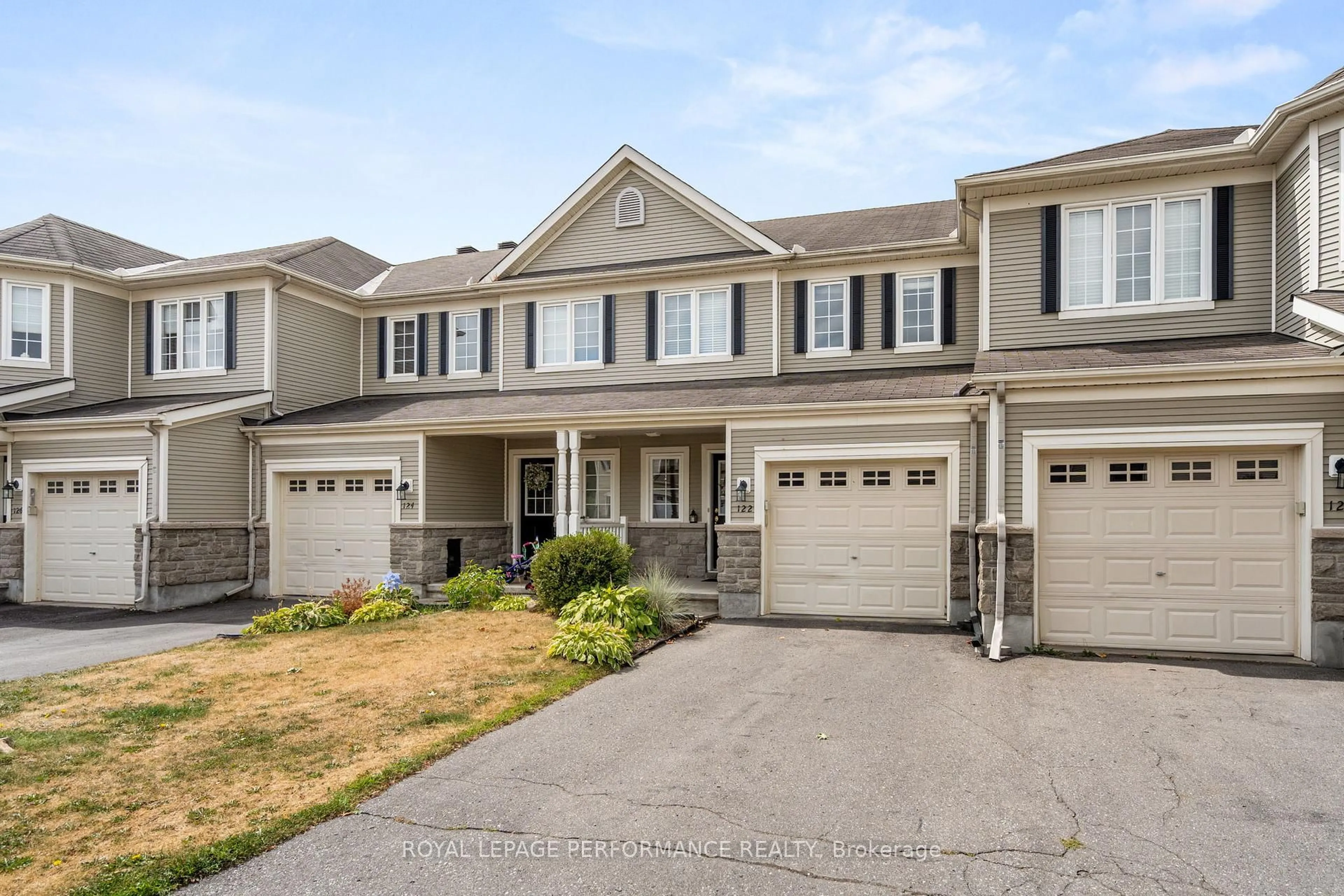 Home with vinyl exterior material, street for 122 Osnabrook Private, Ottawa Ontario K2J 0G8