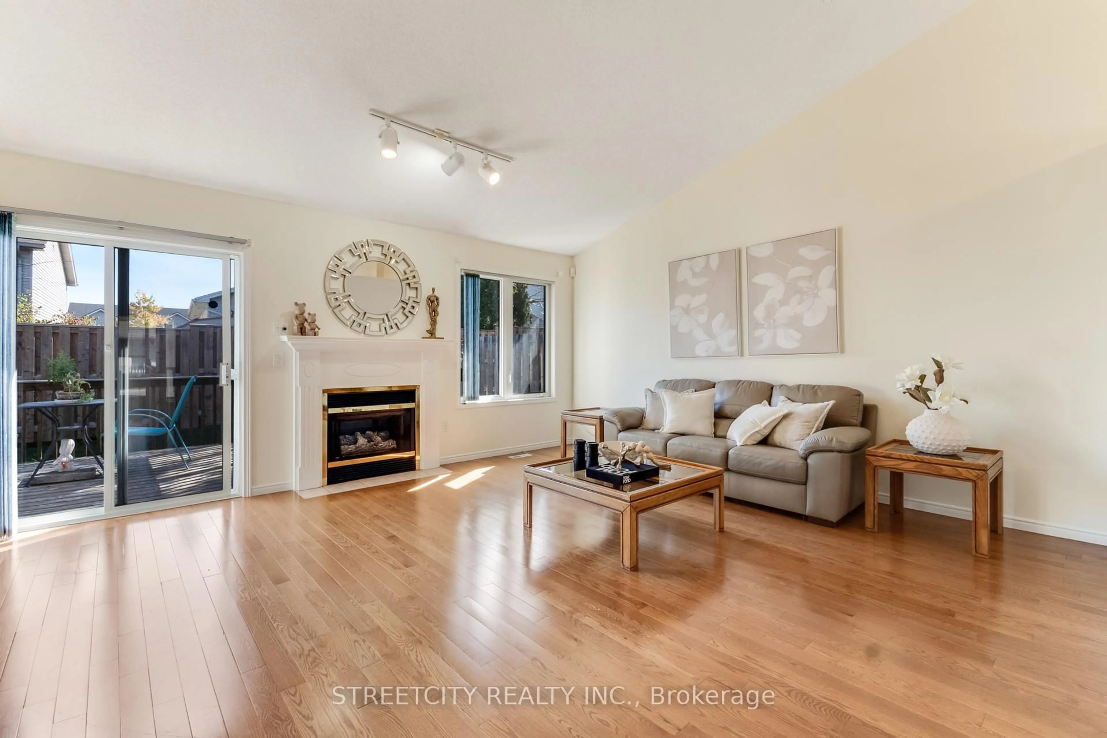 Living room with furniture, wood/laminate floor for 861 Shelborne St #34, London South Ontario N5Z 5C5