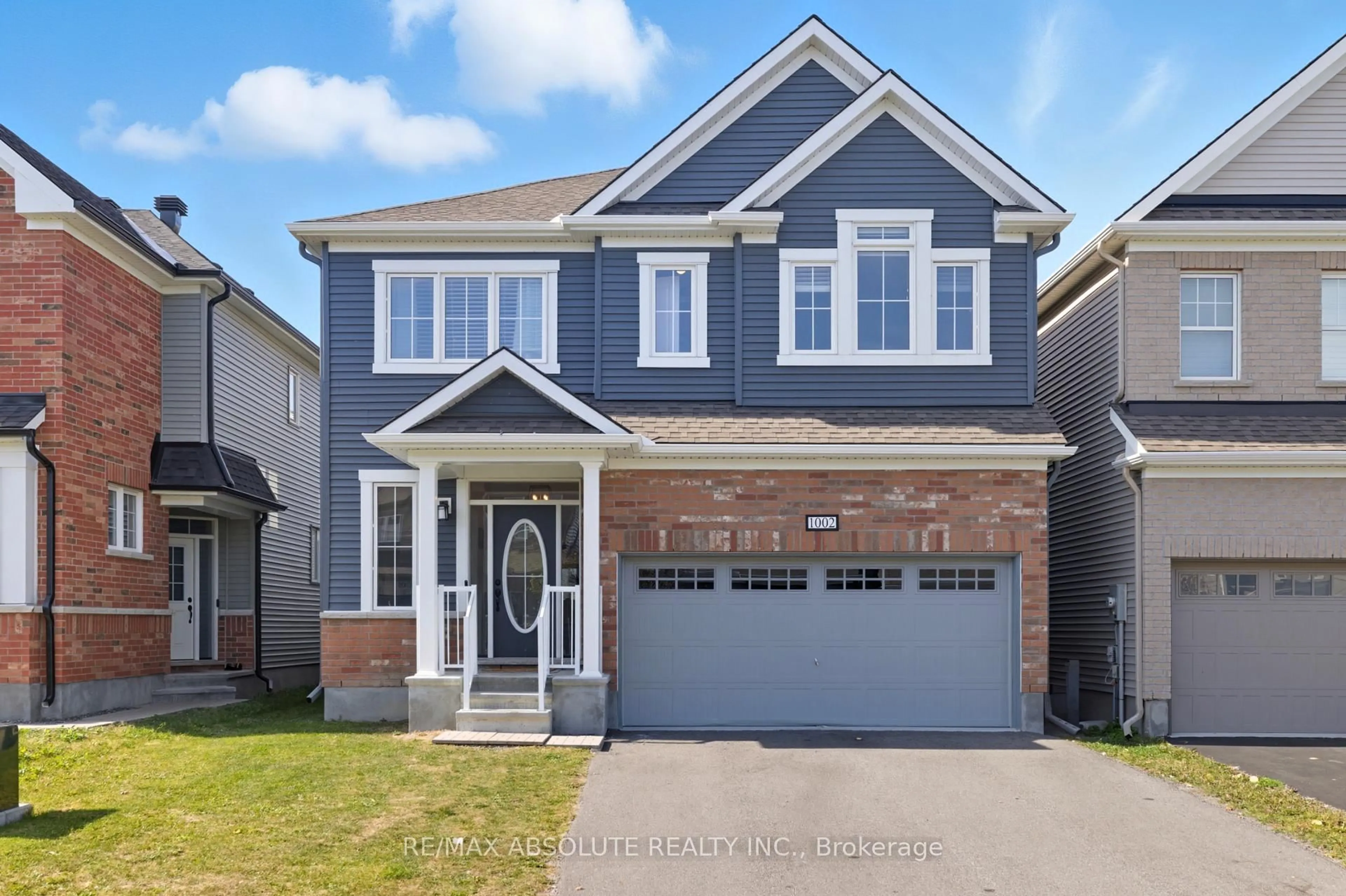 Home with brick exterior material, street for 1002 Cottontail Walk, Ottawa Ontario K1G 3H1