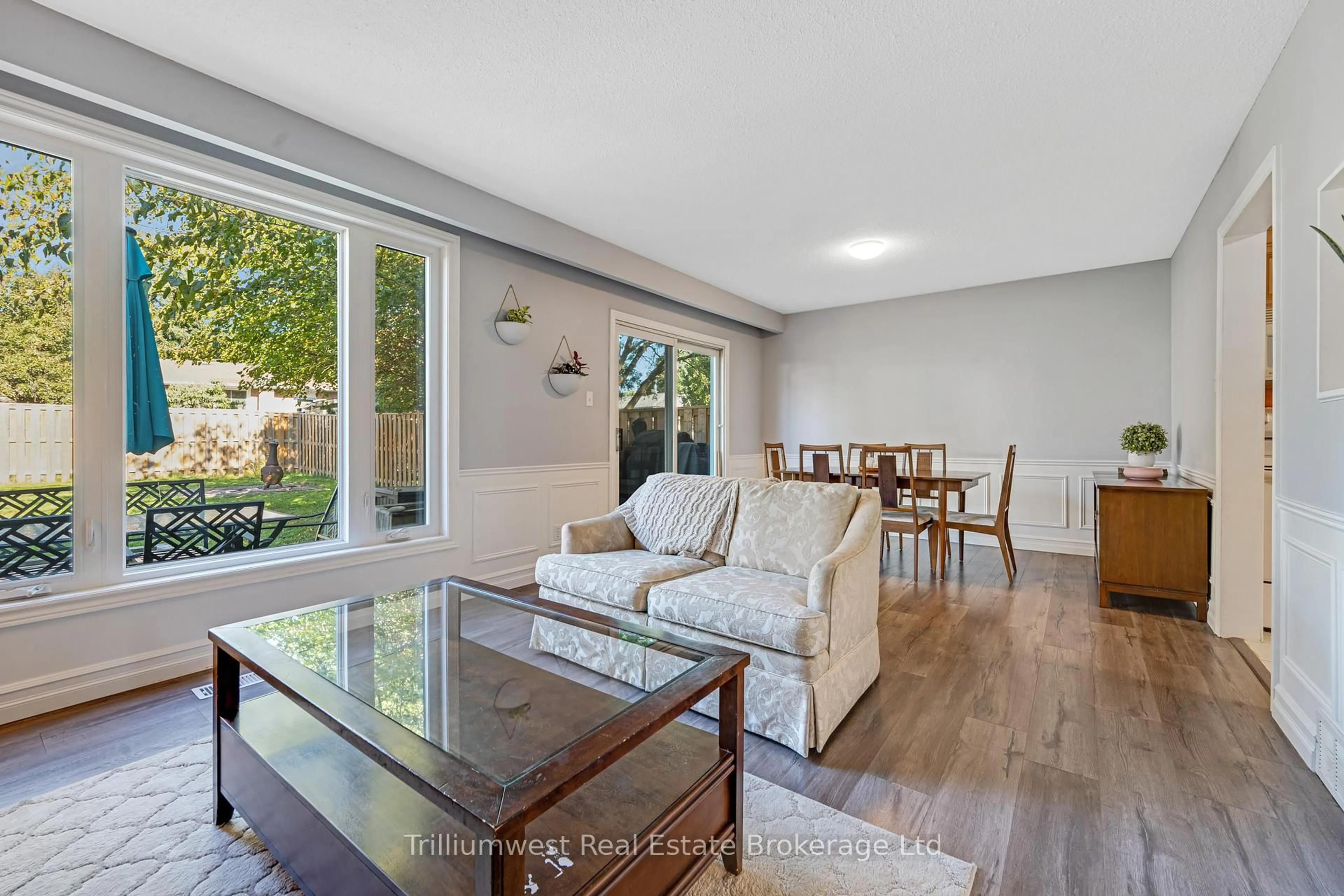 Living room with furniture, wood/laminate floor for 130 Dalegrove Dr, Kitchener Ontario N2M 2G5