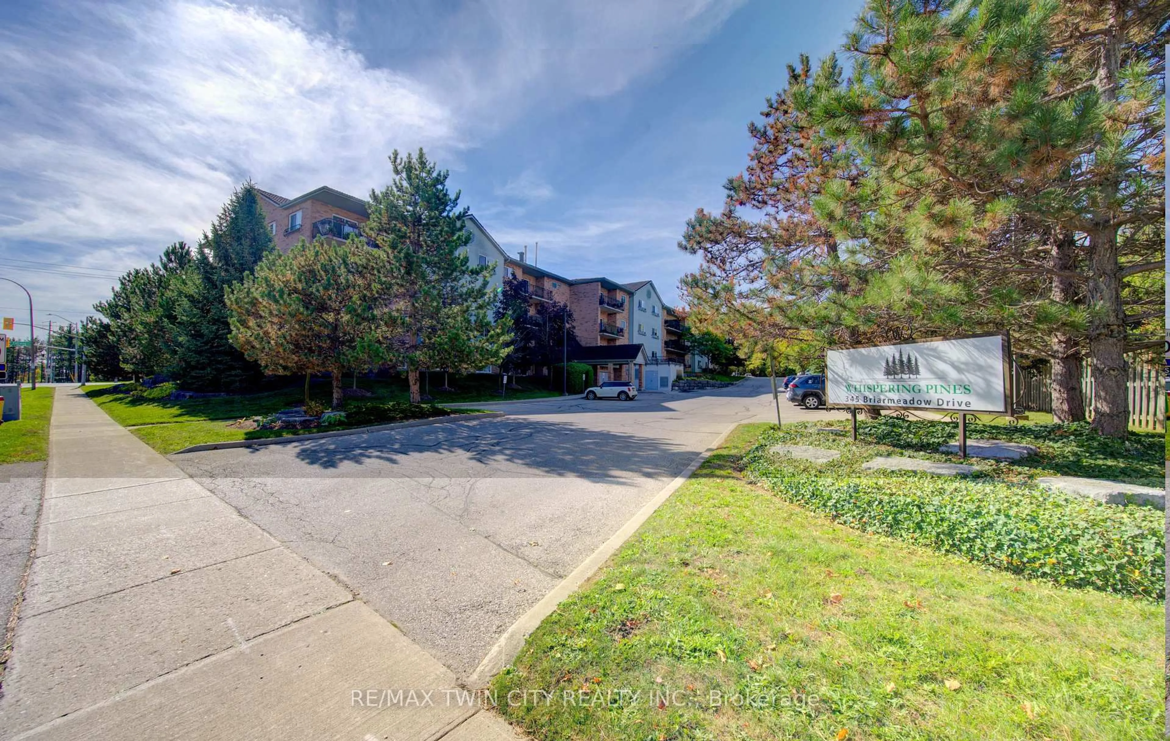 A pic from outside/outdoor area/front of a property/back of a property/a pic from drone, street for 345 Briarmeadow Dr #402, Kitchener Ontario N2A 4J6