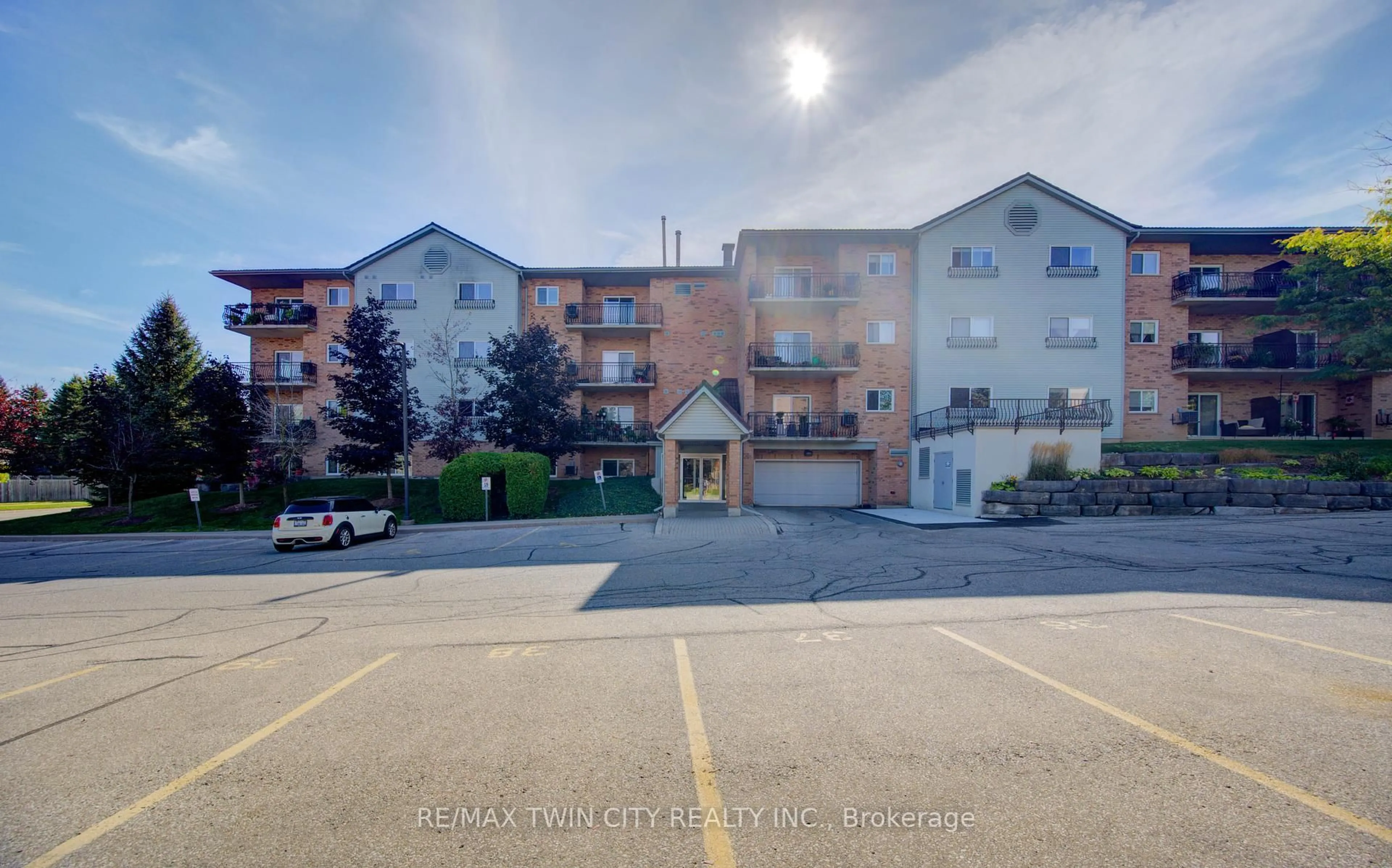 A pic from outside/outdoor area/front of a property/back of a property/a pic from drone, unknown for 345 Briarmeadow Dr #402, Kitchener Ontario N2A 4J6