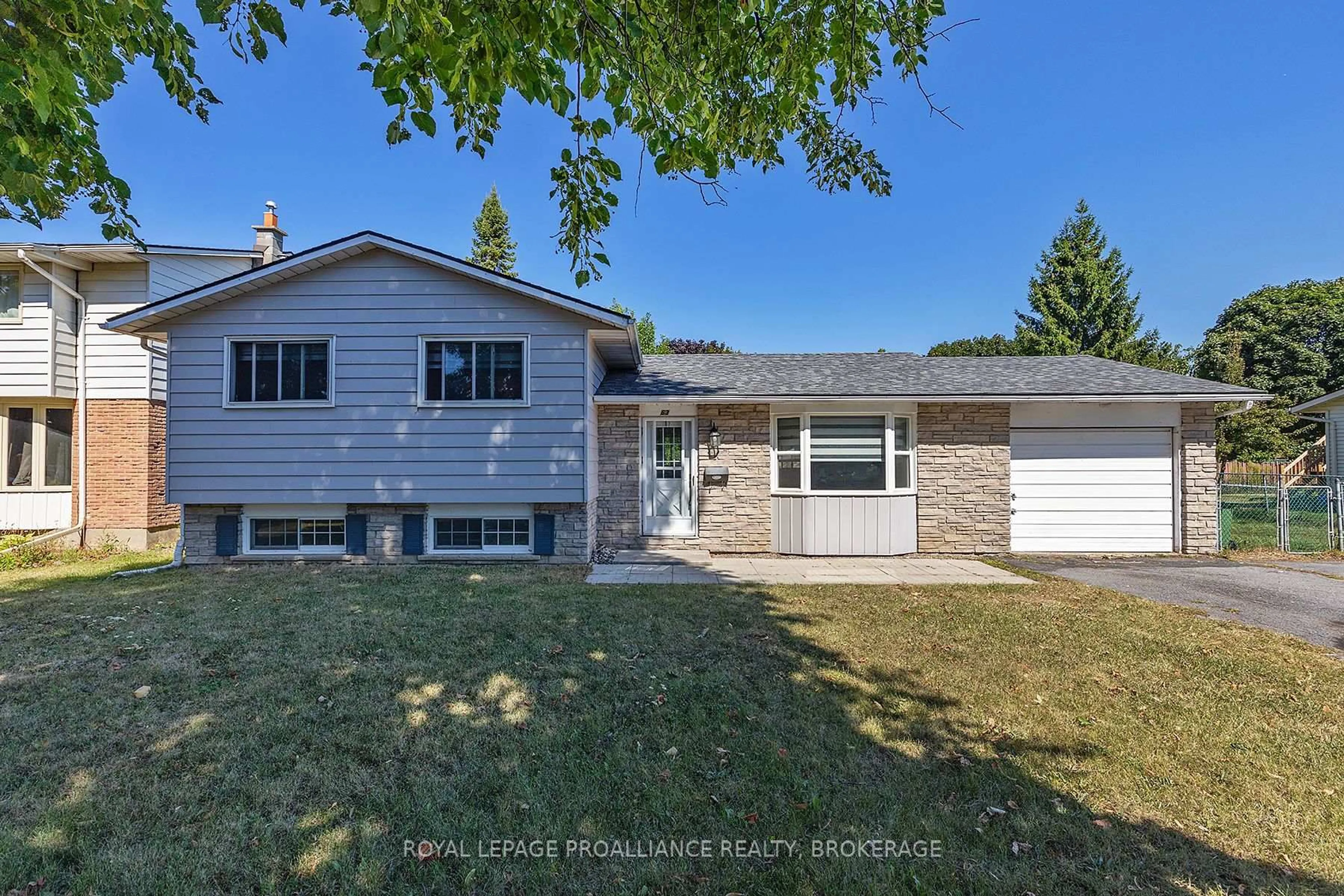 Home with vinyl exterior material, street for 63 Old Oak Rd, Kingston Ontario K7M 6X2