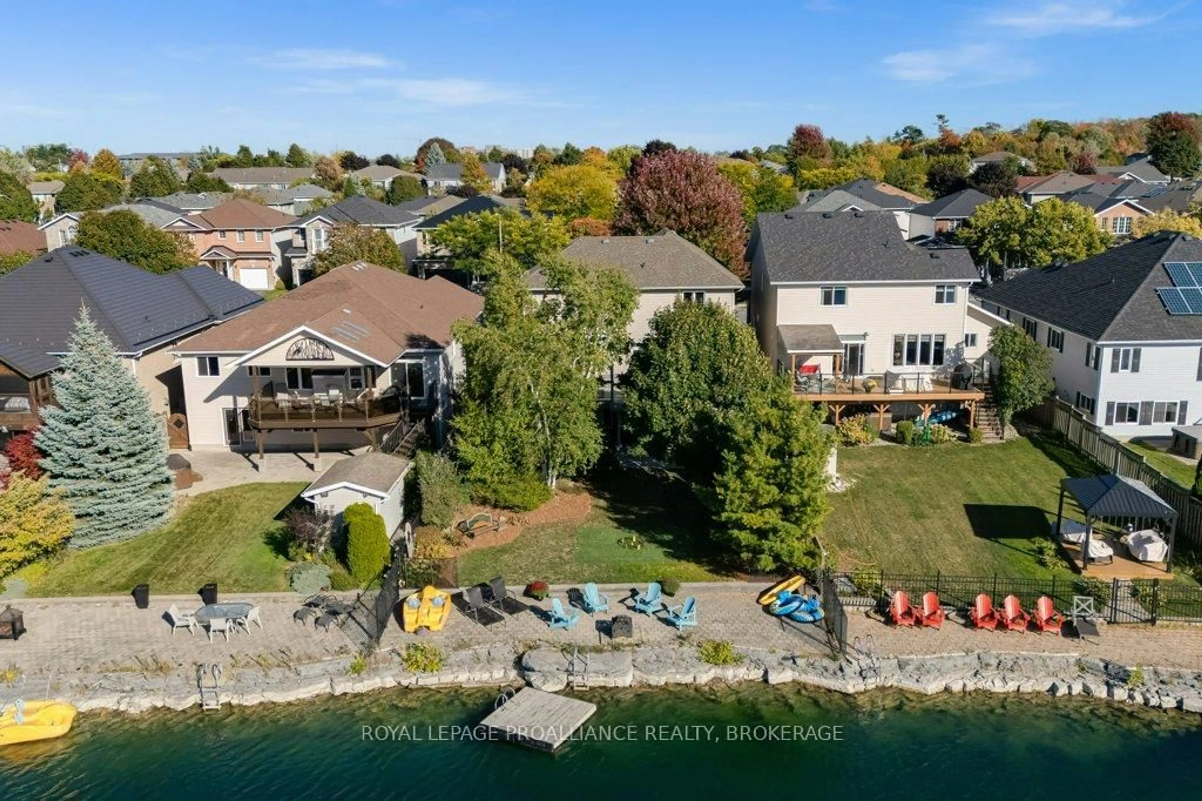 A pic from outside/outdoor area/front of a property/back of a property/a pic from drone, water/lake/river/ocean view for 1415 Stoneridge Dr, Kingston Ontario K7M 9H6