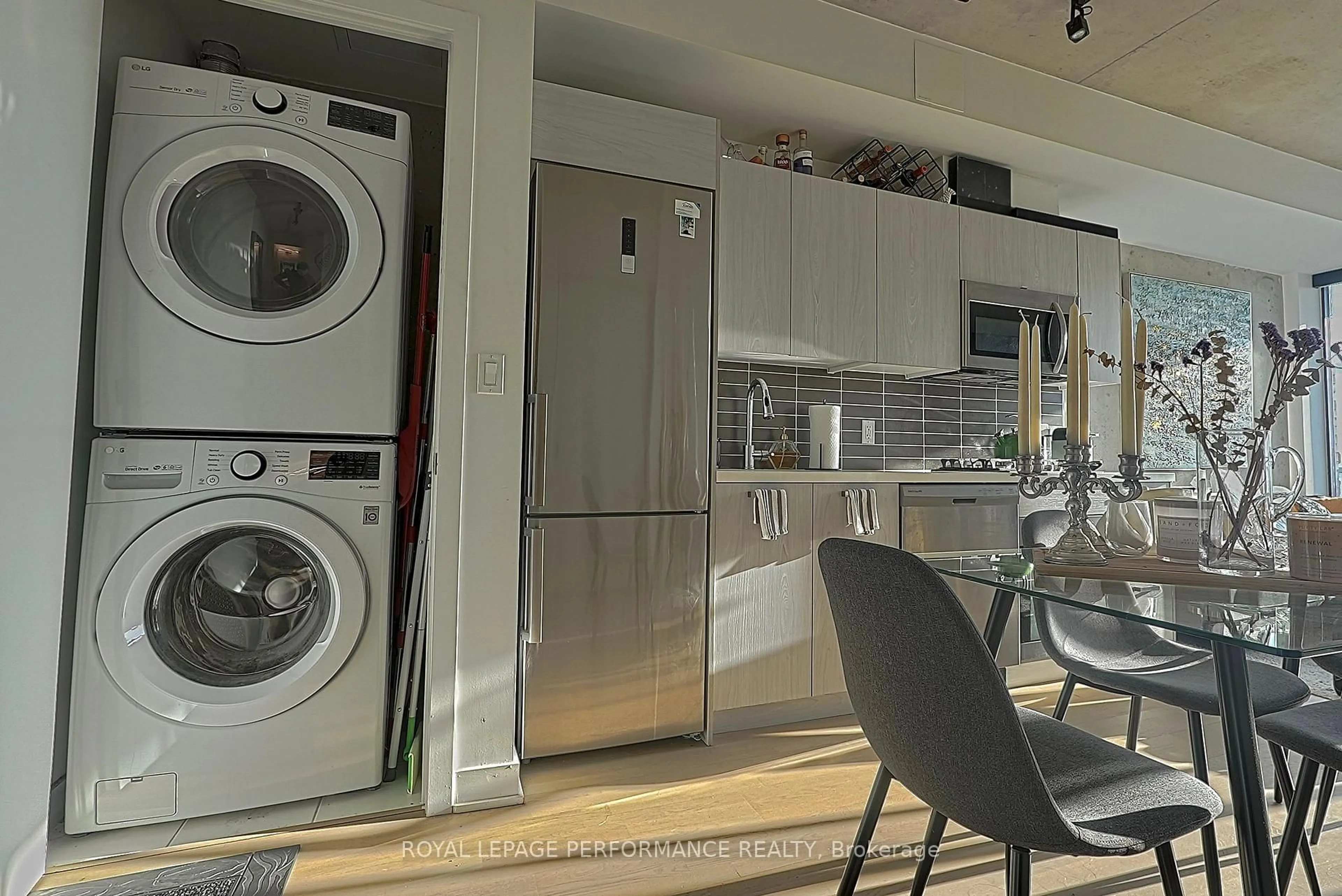 Kitchen with laundary machines, unknown for 203 Catherine St #1804, Ottawa Ontario K2P 1J5