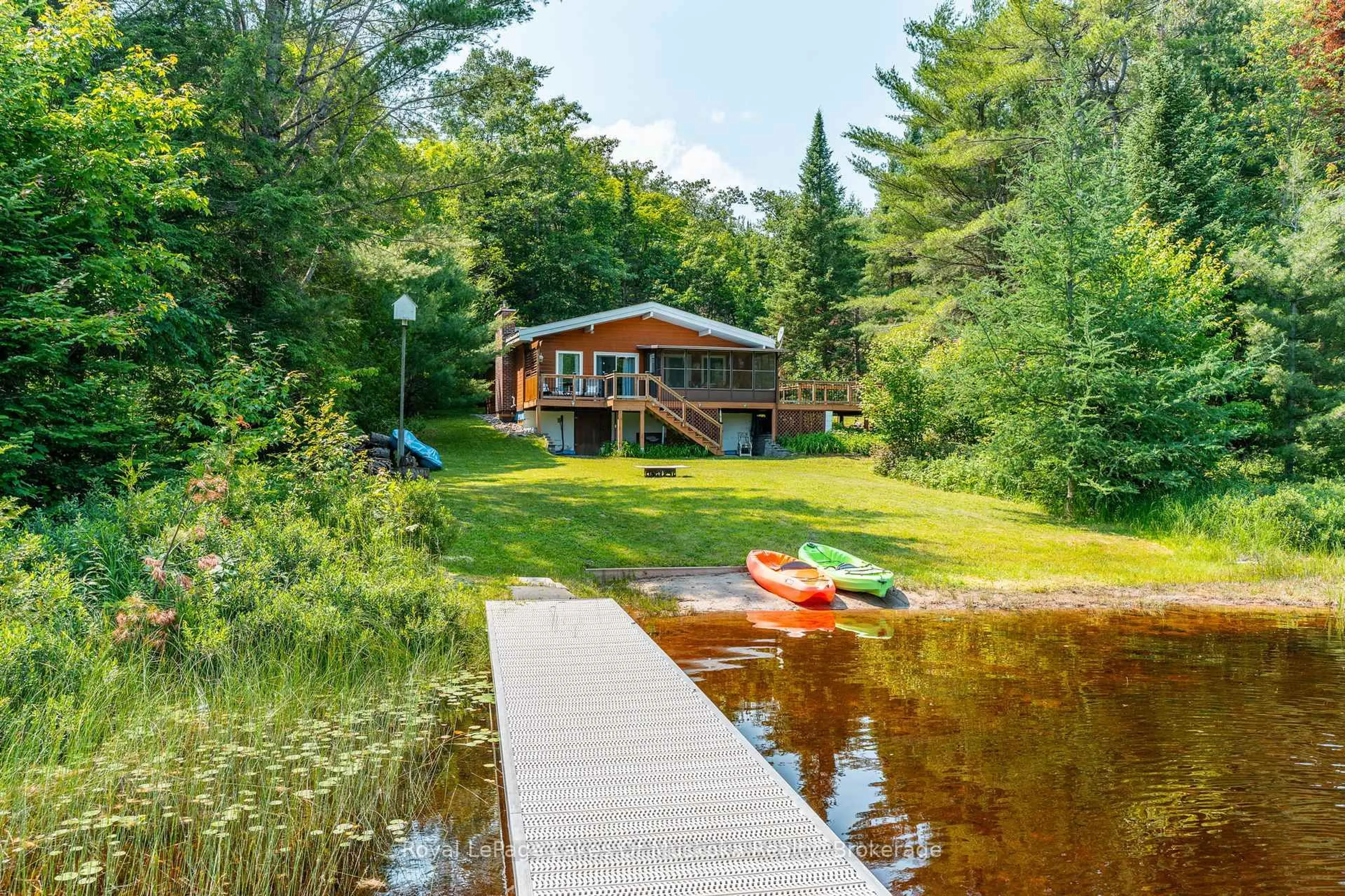 A pic from outside/outdoor area/front of a property/back of a property/a pic from drone, water/lake/river/ocean view for 1035 Atkins Lake Rd, Bracebridge Ontario P1L 1W9