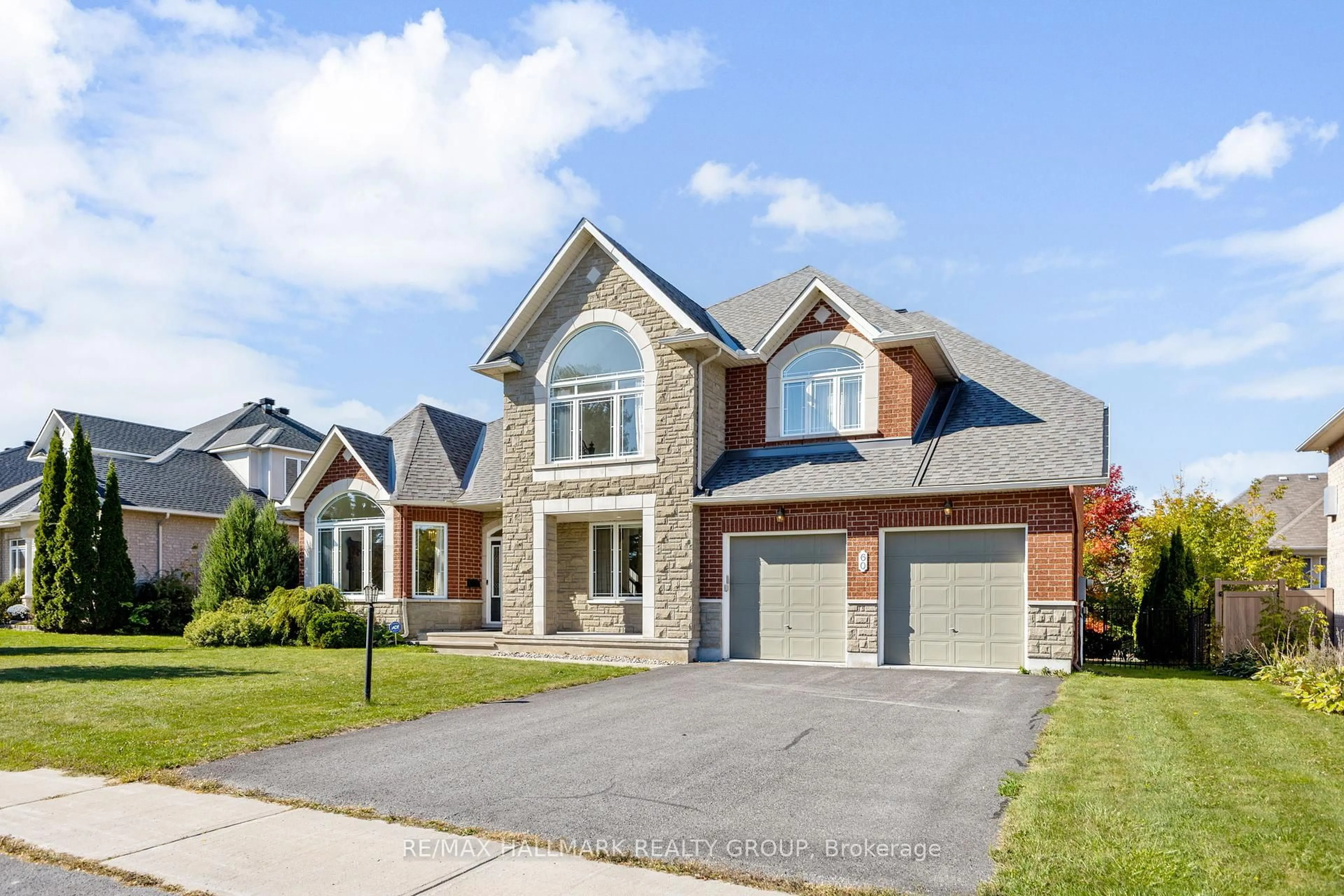 Home with brick exterior material, street for 60 Winding Way, Barrhaven Ontario K2G 6Y6