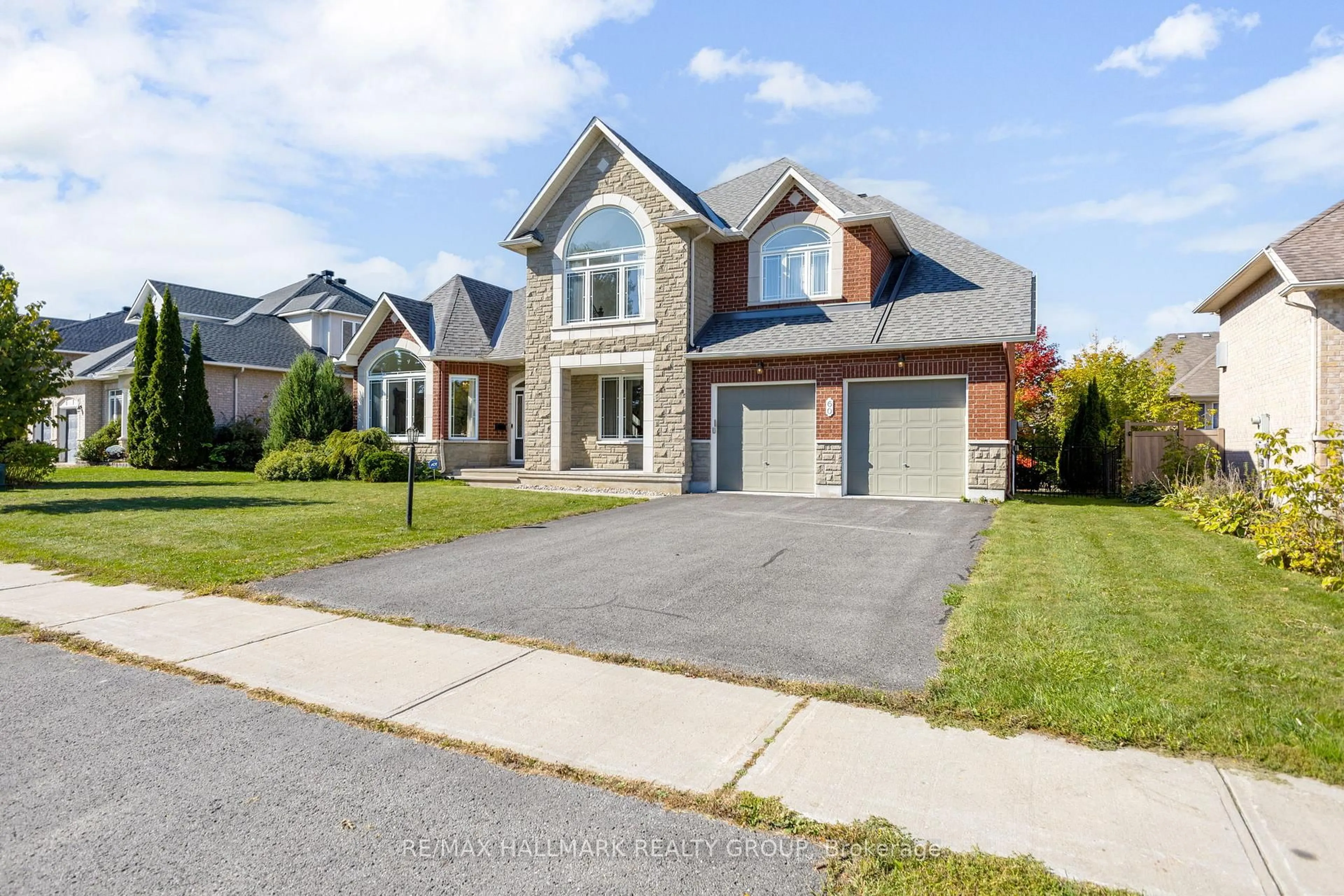Home with brick exterior material, street for 60 Winding Way, Barrhaven Ontario K2G 6Y6
