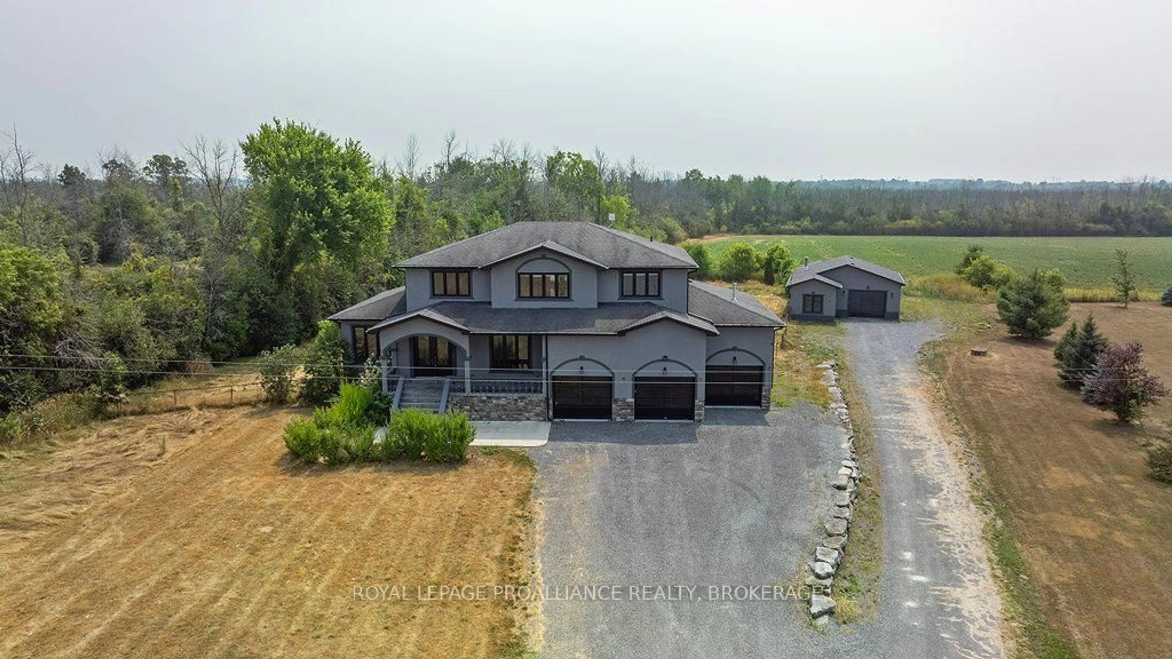 A pic from outside/outdoor area/front of a property/back of a property/a pic from drone, water/lake/river/ocean view for 1058 Lucas Rd, Bissett Creek Ontario K0H 2H0
