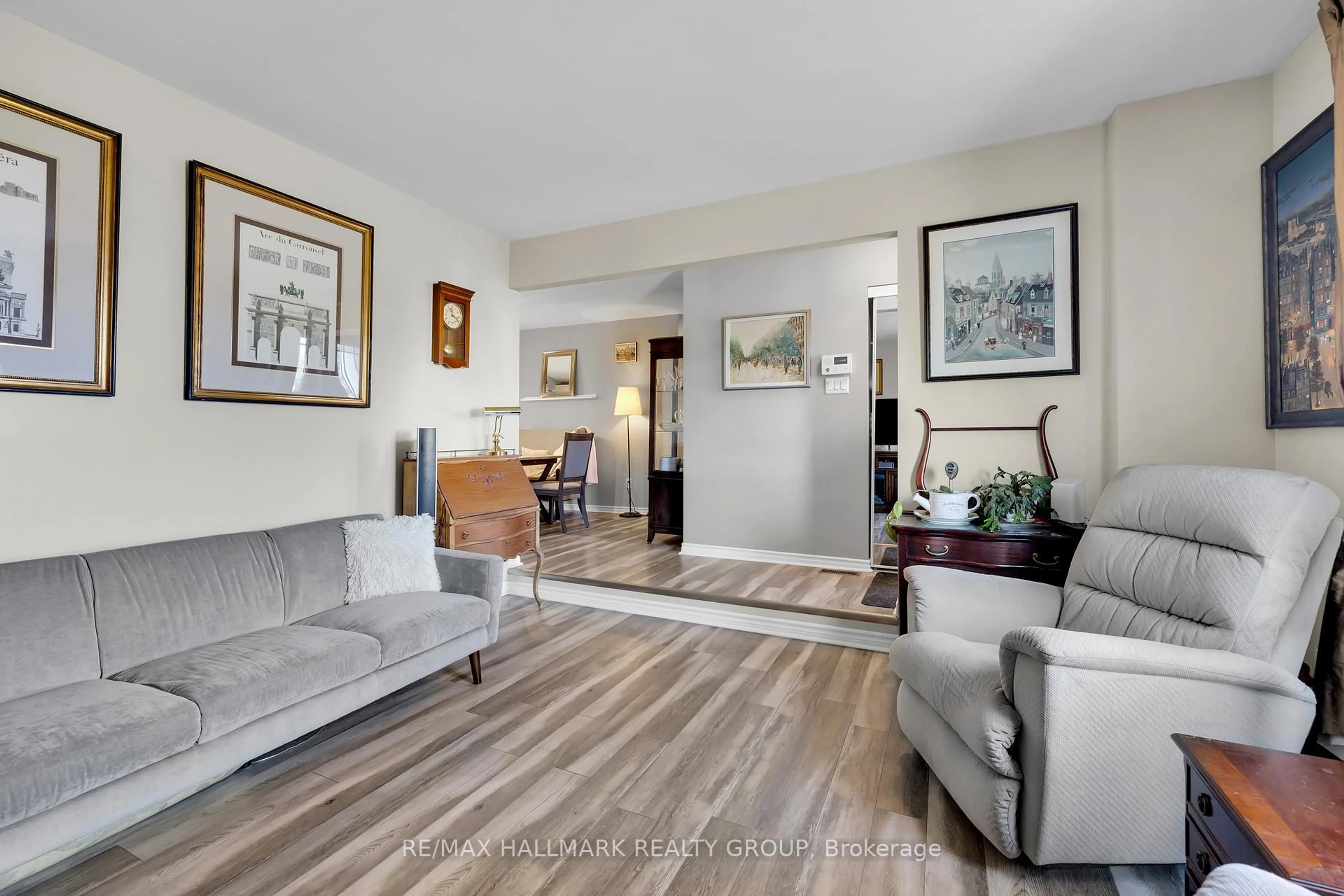 Living room with furniture, wood/laminate floor for 34 Menard St, Russell Ontario K0A 1W0