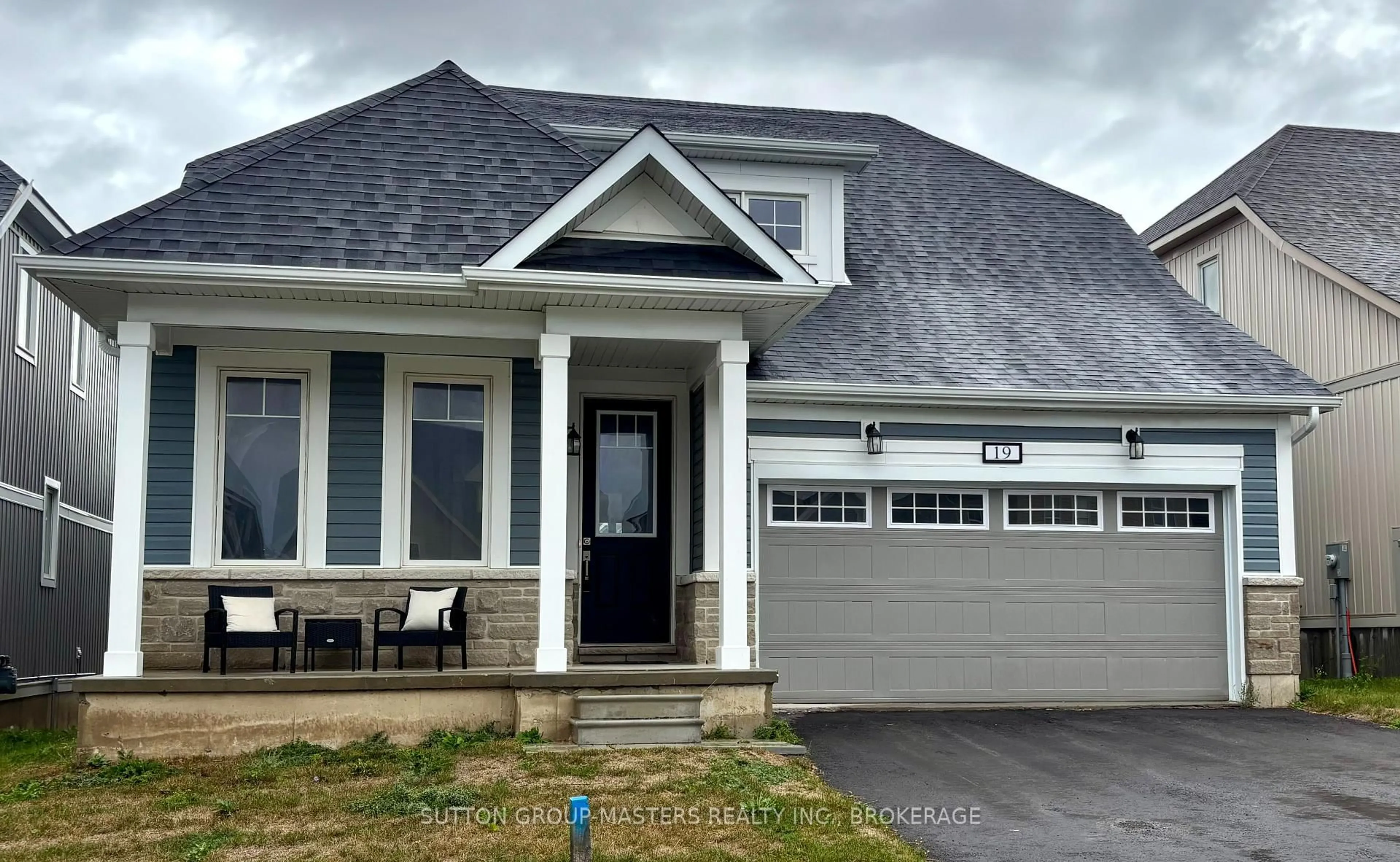 Home with vinyl exterior material, street for 19 OAKMONT Dr, Bath Ontario K0H 1G0
