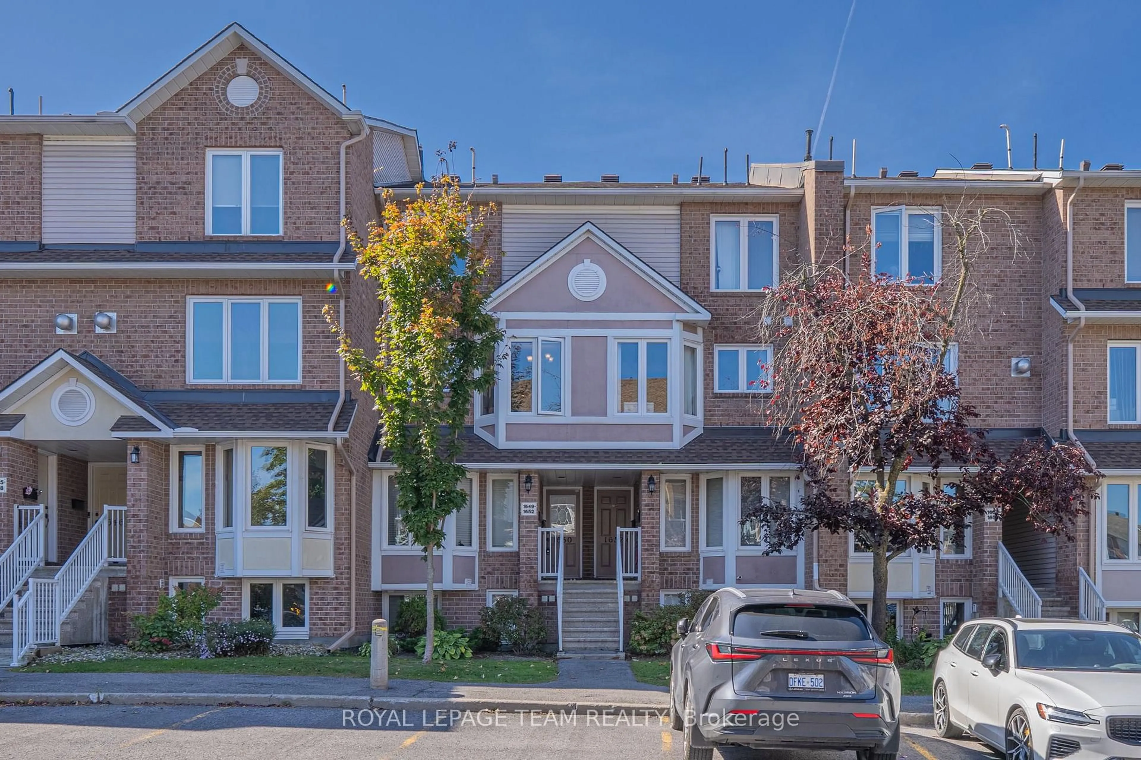 Home with brick exterior material, street for 1650 Locksley Lane, Ottawa Ontario K1J 1B6