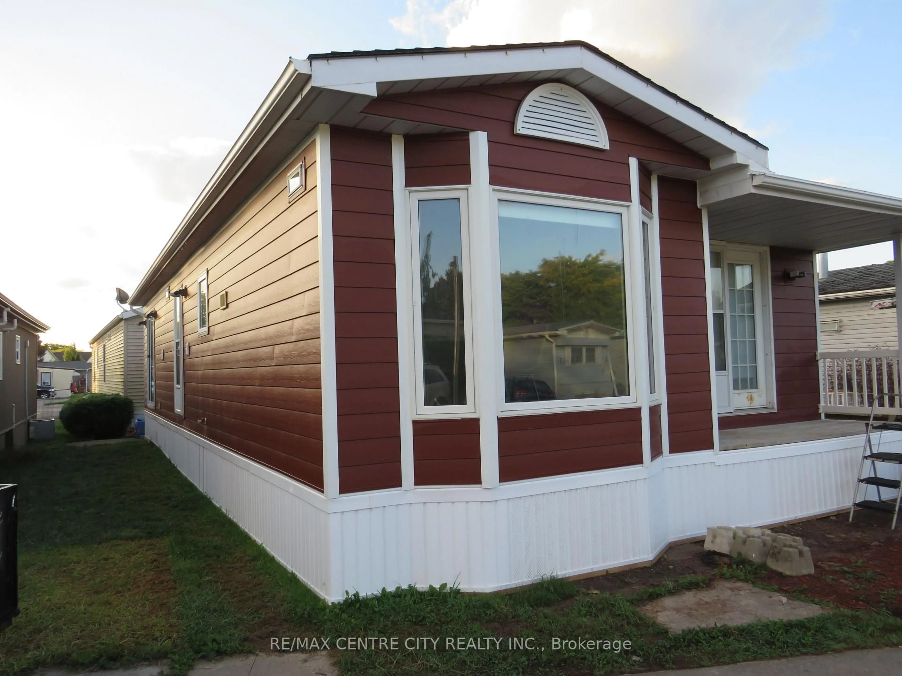 Home with vinyl exterior material, street for 2189 Dundas St #106, London East Ontario N5V 1H3